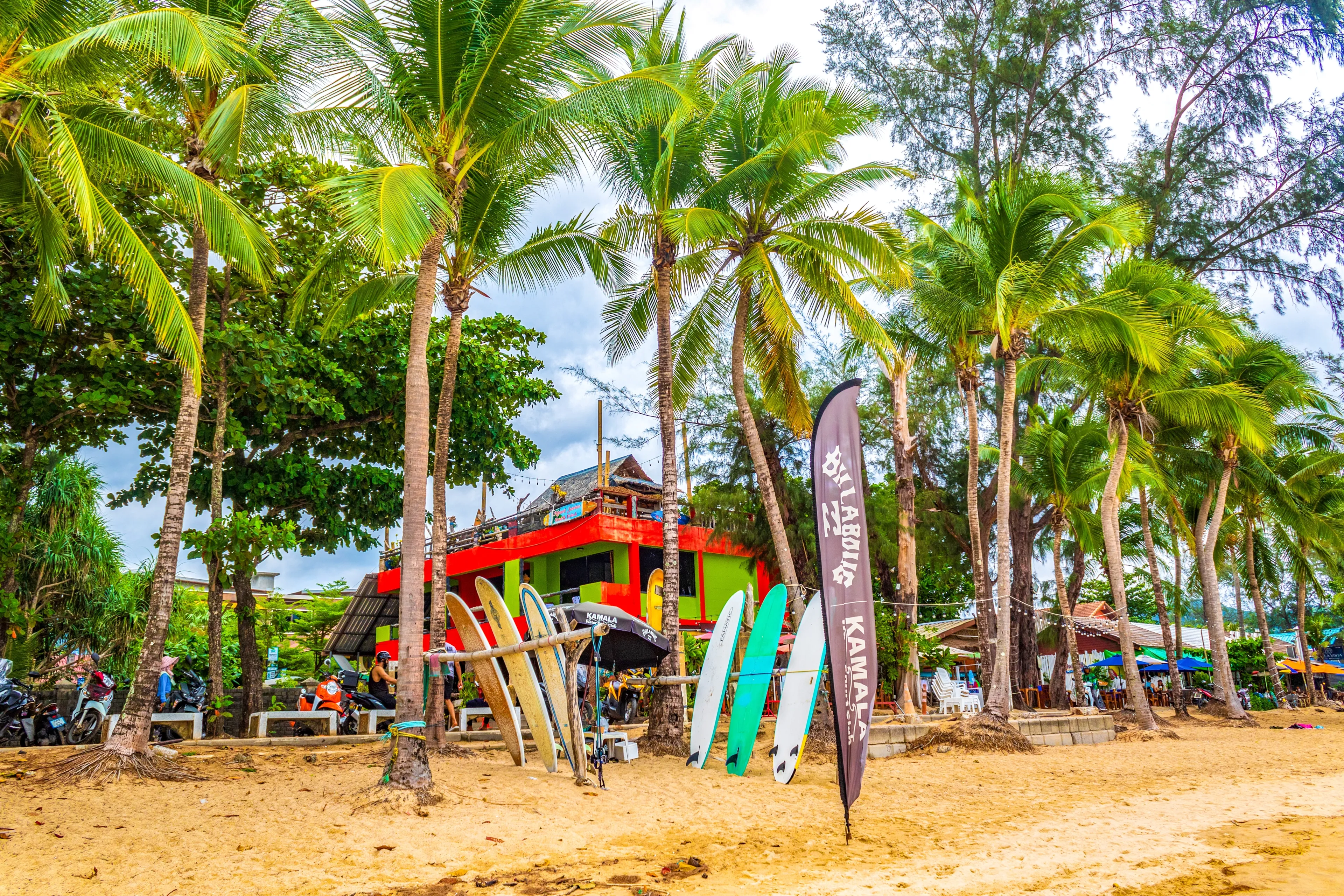 Kamala beach,Phuket,Thailand-May 11th 2024:View of sandy Kamala beach with water sports attractions and beachside bars and restaurants
