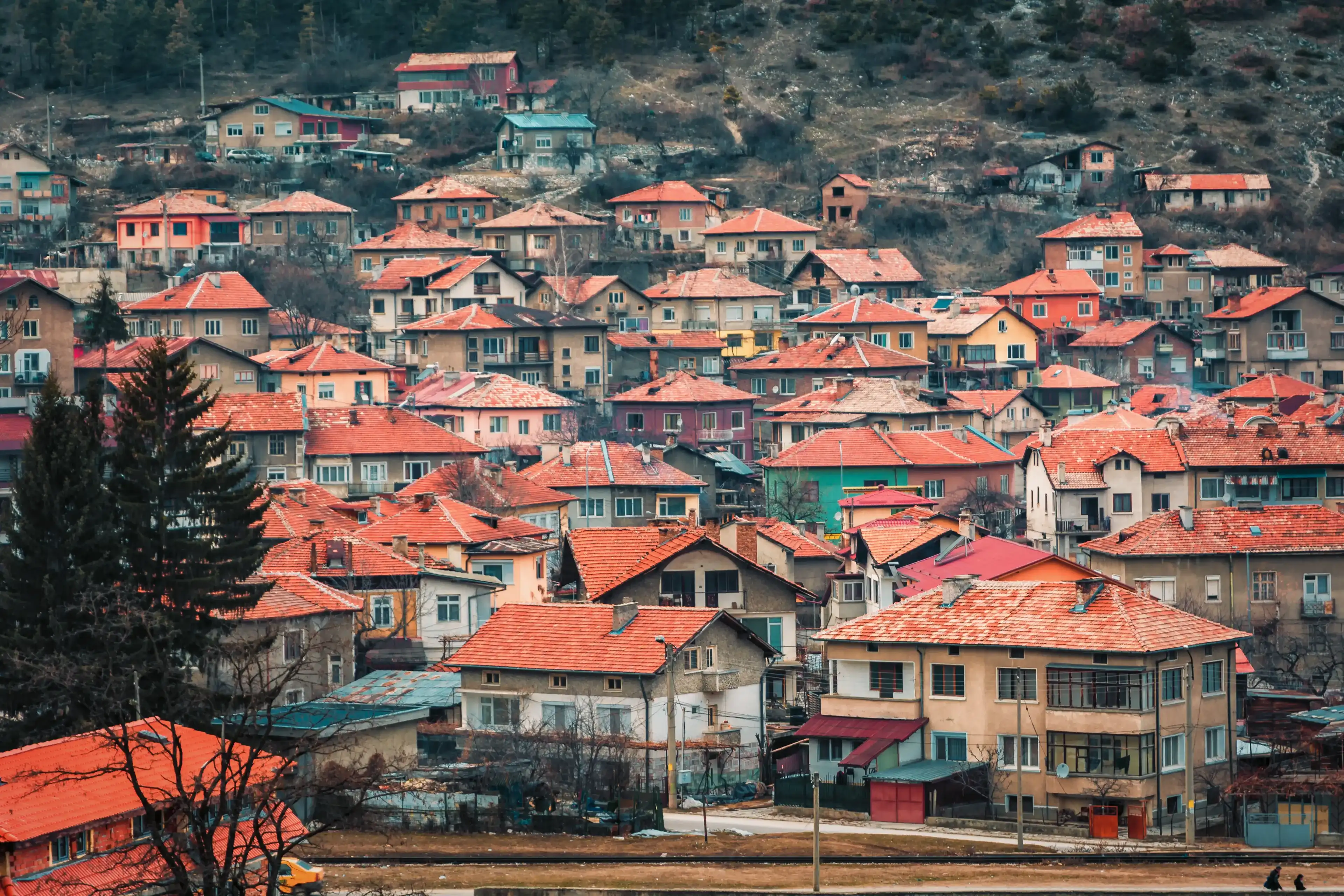 Velingrad, Bulgaria. Beautiful view over red small houses in the Balkan Spa Capital Velingrad in Rhodope Mountains. Velingrad, Bulgaria. Beautiful view over red small houses in the Balkan Spa Capital Velingrad in Rhodope Mountains.