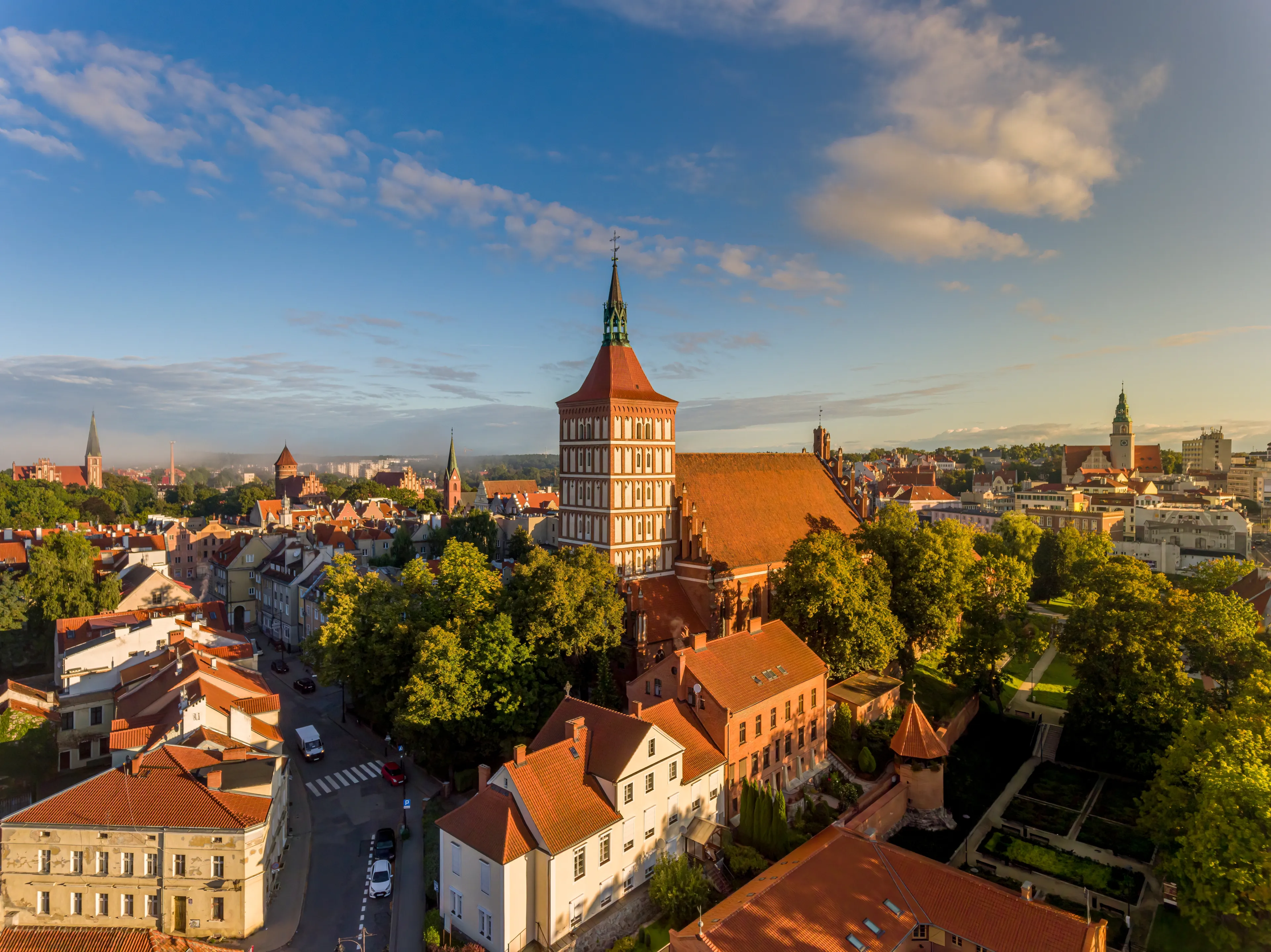St. James, Evangelical church, castle of the Warmian chapter, garrison church of the Blessed Virgin Mary, Queen of Poland and the town hall - at sunrise - Olsztyn, Warmia and Masuria, Poland, Europe