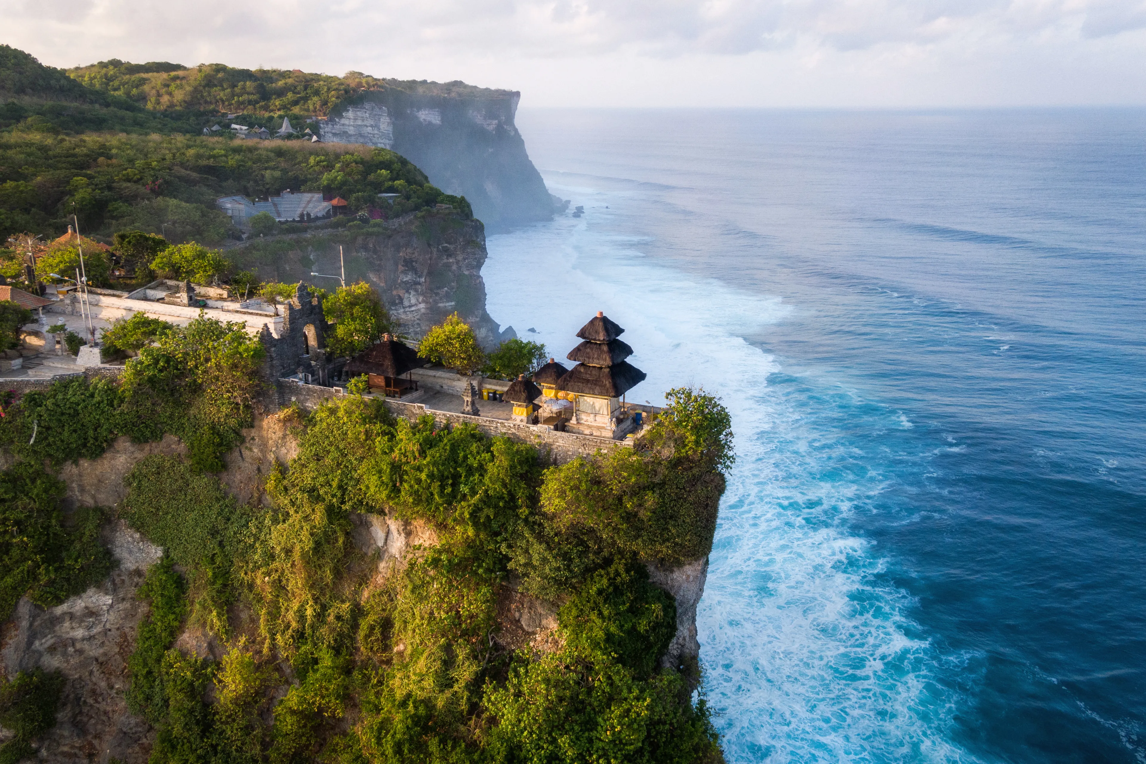Bali, Indonesia, aerial view of Pura Luhur Uluwatu temple at sunrise.