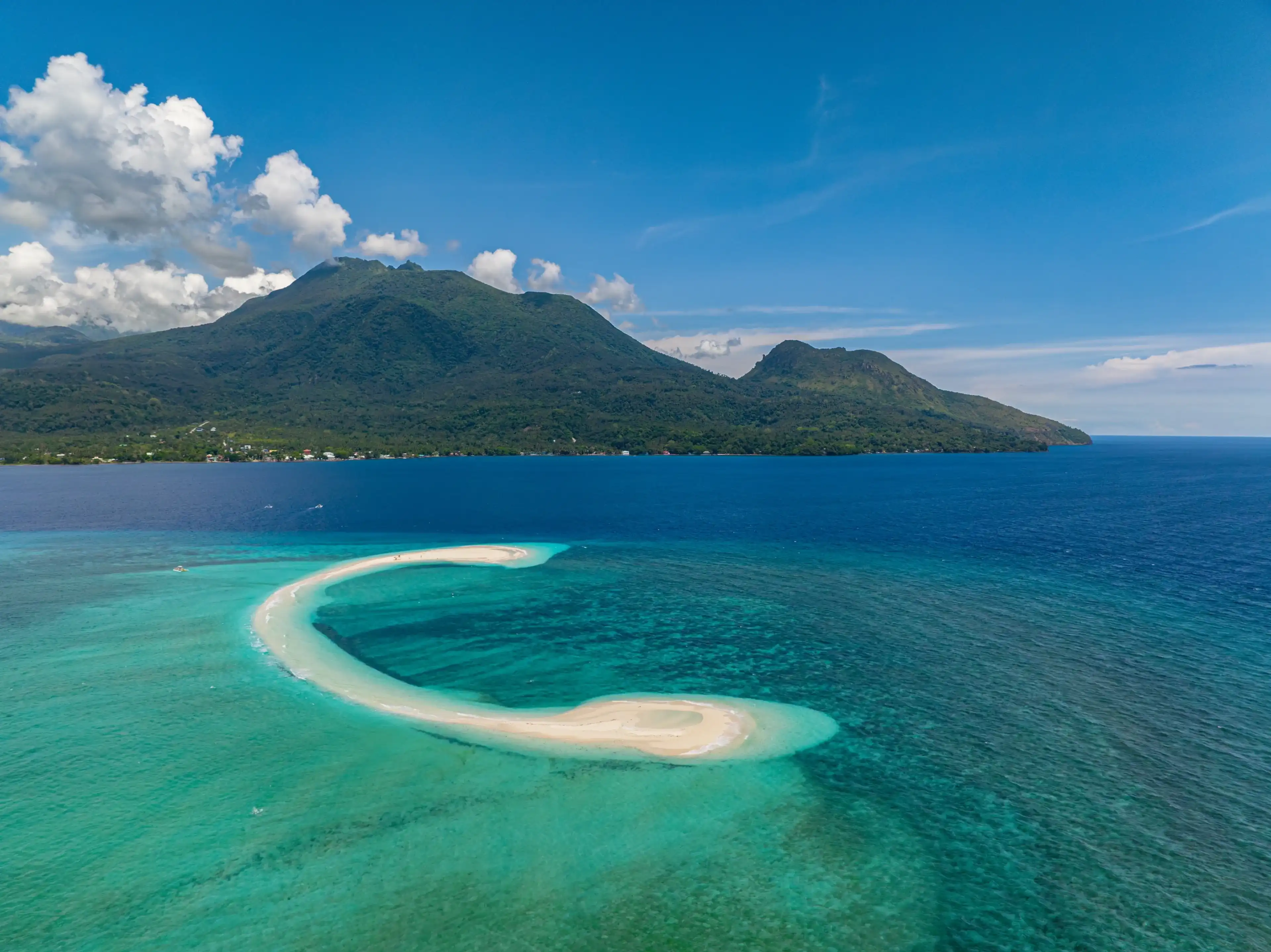 Aerial view of white sandbar with ocean waves in White Island. Camiguin Island.Philippines.
