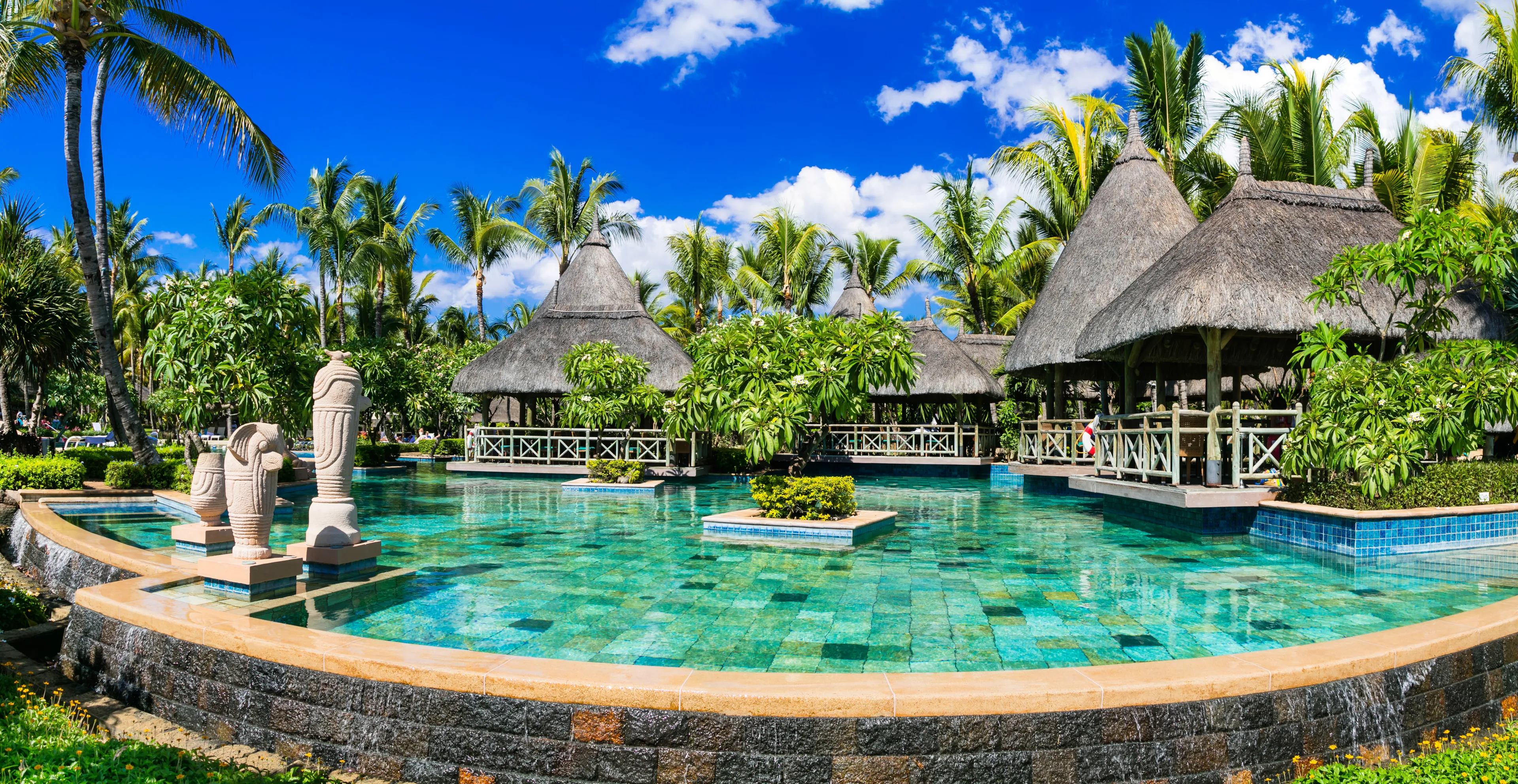 Tropical vacations. Swimming pool and lounge bar in Mauritius island. 5 stars hotels in Flic en Flac beach
