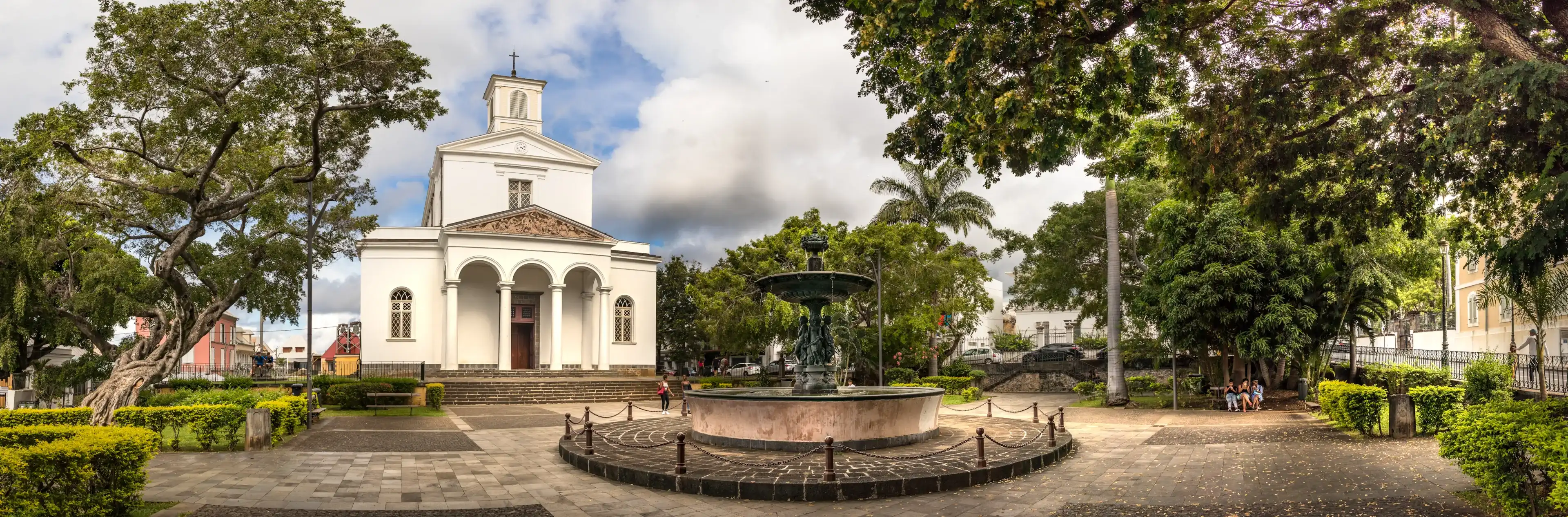 Saint Denis, Reunion Island - January 26th, 2019: Panoramic view of the St Denis Cathedral located next the Cathedral Fountain., Reunion Island.