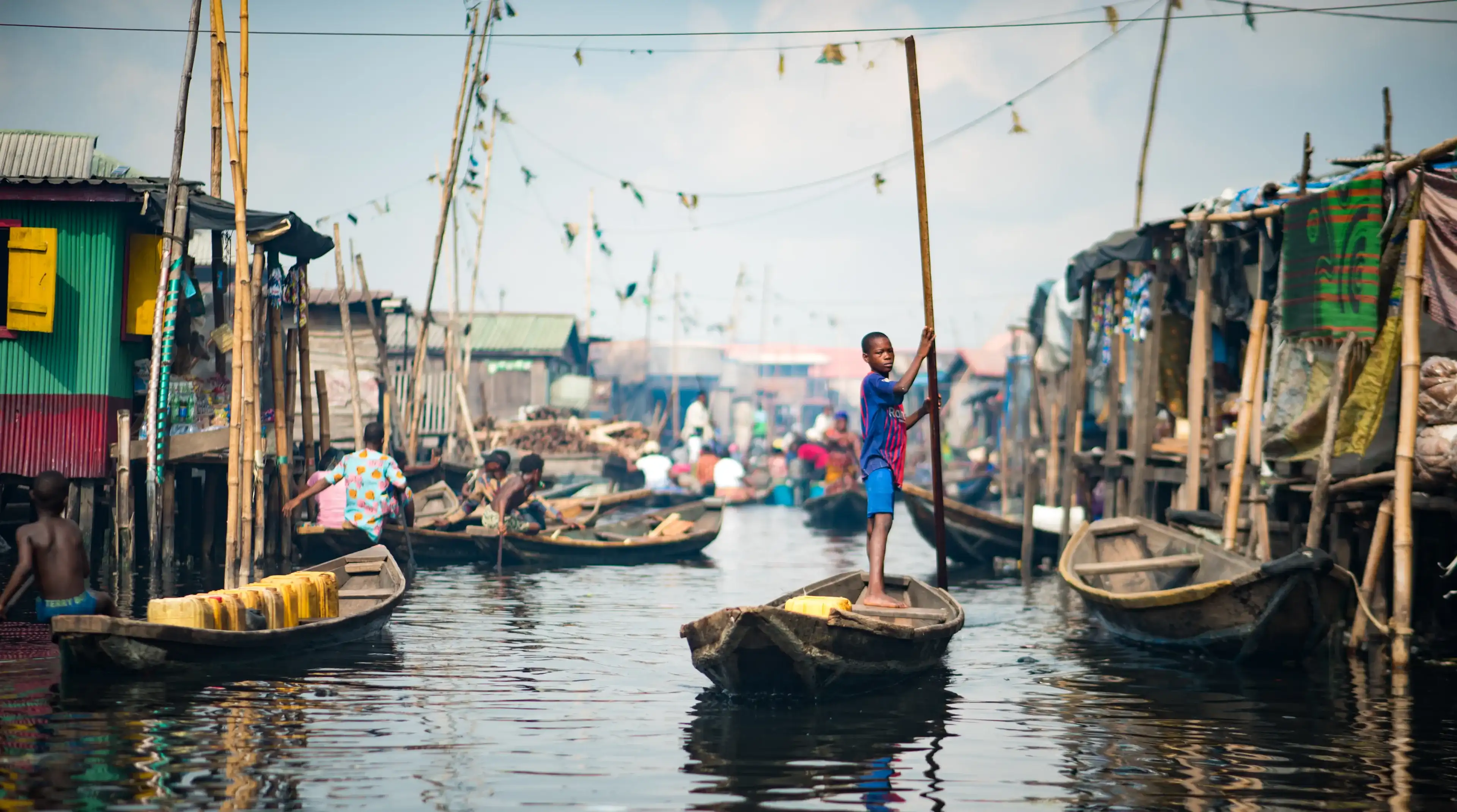A young boy rowing a Canoe in the Makoko Stilts Village, Lagos/ Nigeria taken on the 18th of May, 2019
