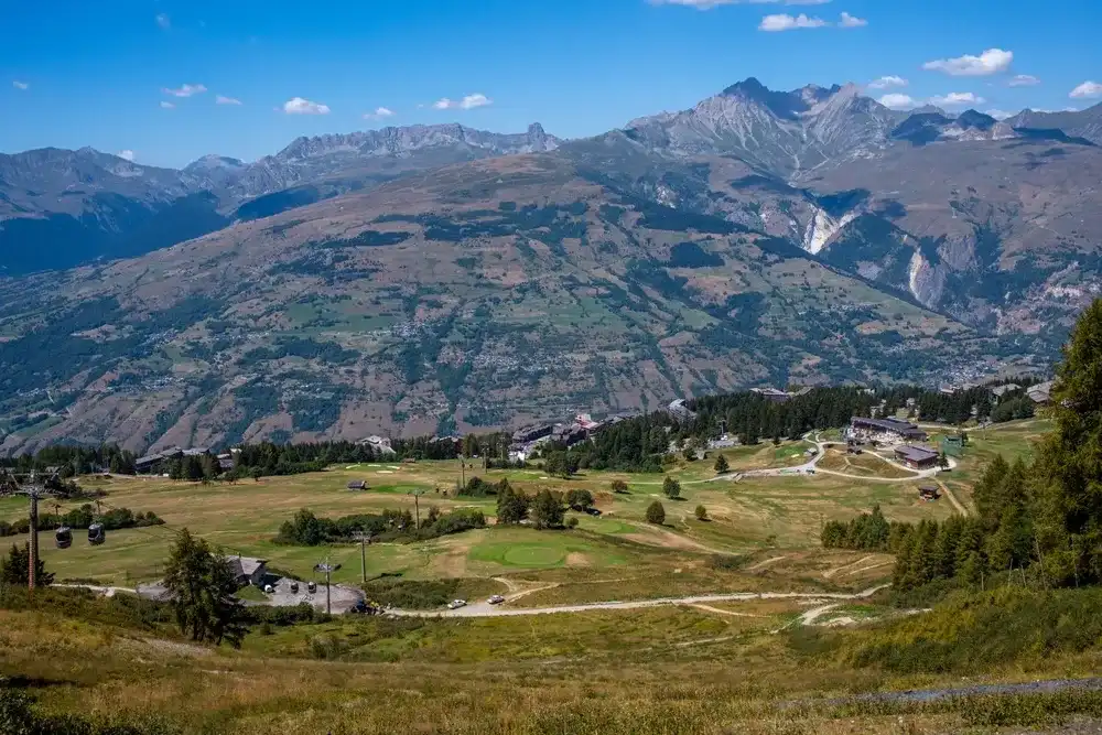 Bourg-saint-maurice, France - 22-08-2023: view of the golf courses in summer in the resort of Les Arcs 1600 in the French Alps. Bourg-saint-maurice, France - 22-08-2023: view of the golf courses in summer in the resort of Les Arcs 1600 in the French Alps.