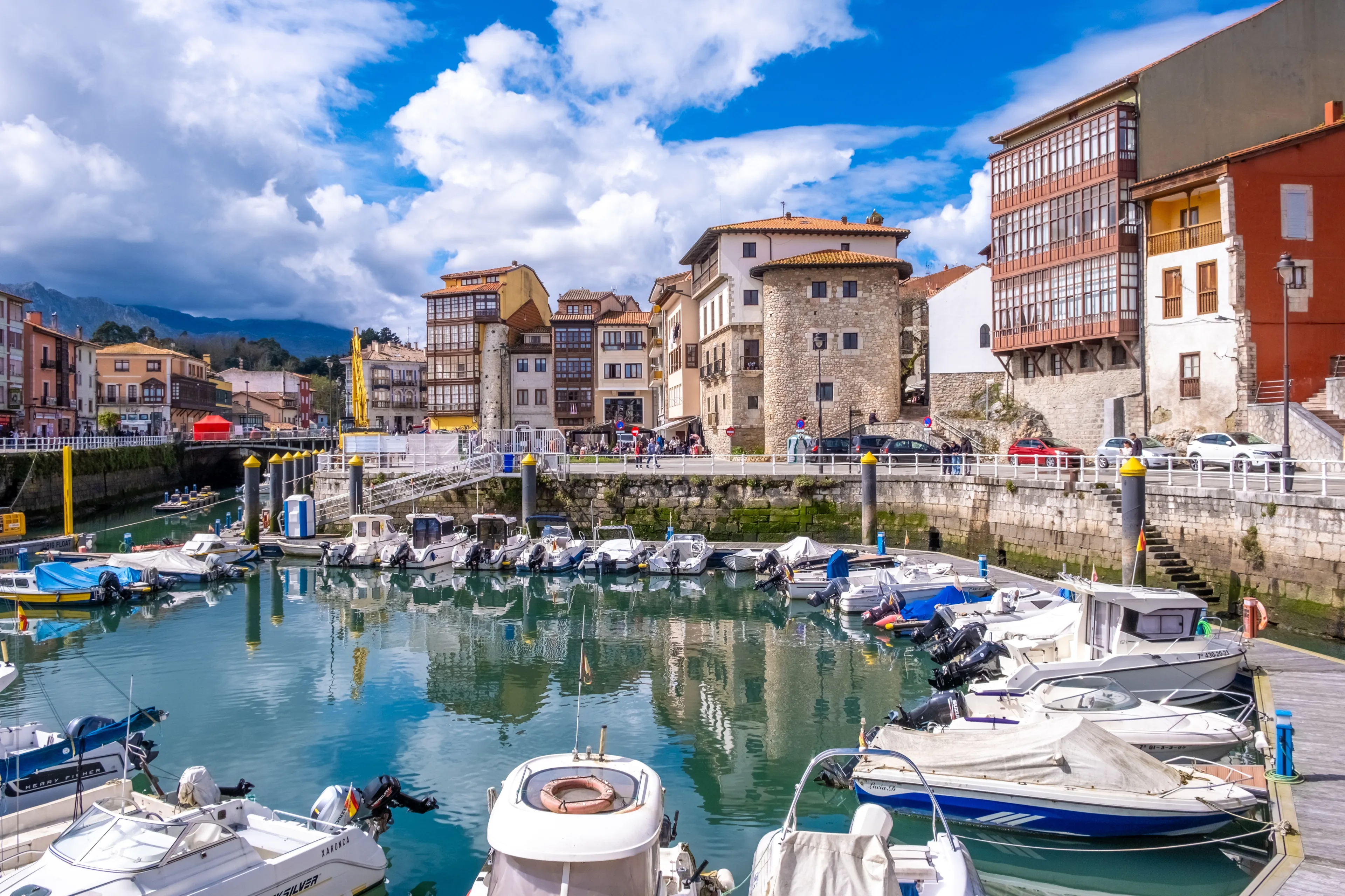 Llanes, Spain - March 31, 2024: Port of Llanes, protected boats in a typical Asturian sea port.