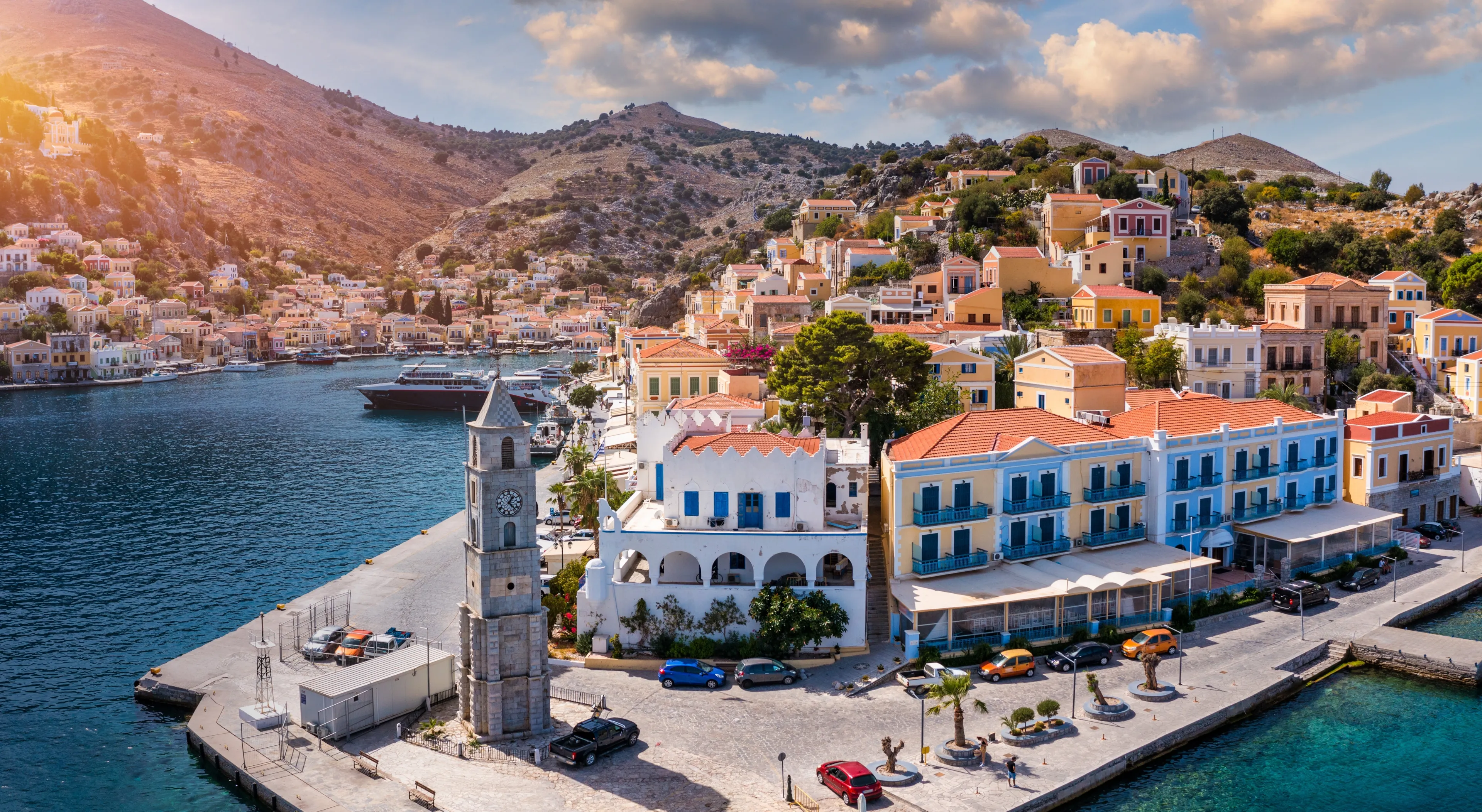 Aerial view of the beautiful greek island of Symi (Simi) with colourful houses and small boats. Greece, Symi island, view of the town of Symi (near Rhodes), Dodecanese.