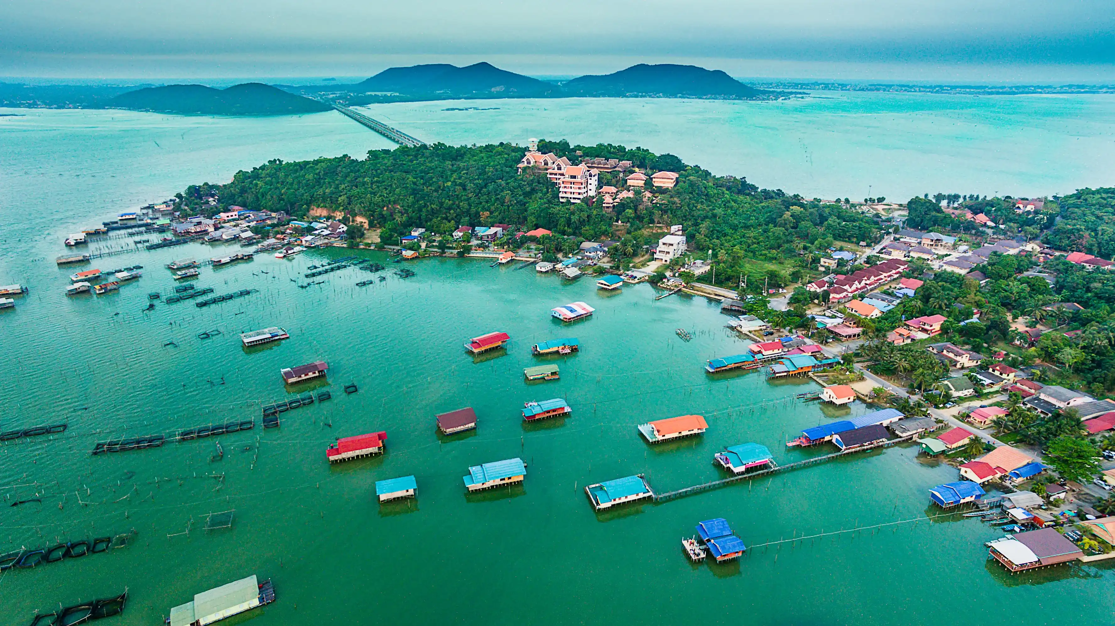 View of wooden house on the lake with island, Songkhla lake, Koh Yo island, Songkhla province,Thailand, Top view from drone