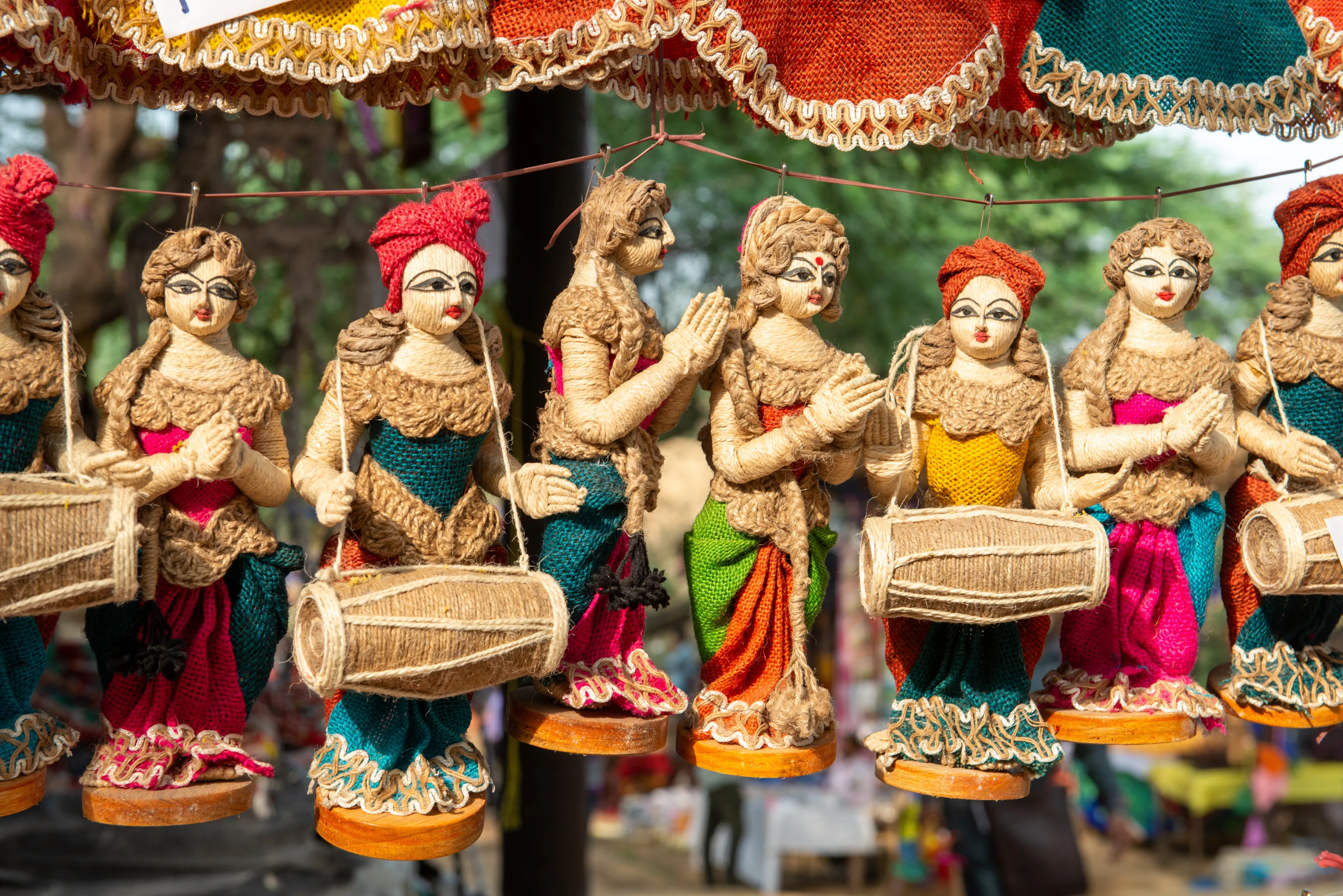 Faridabad, Haryana, India-23 March 2022: Jute dolls showcasing during 35th Surajkund International Crafts Mela in Faridabad, India. Over 30 countries are participating in Surajkund fair.