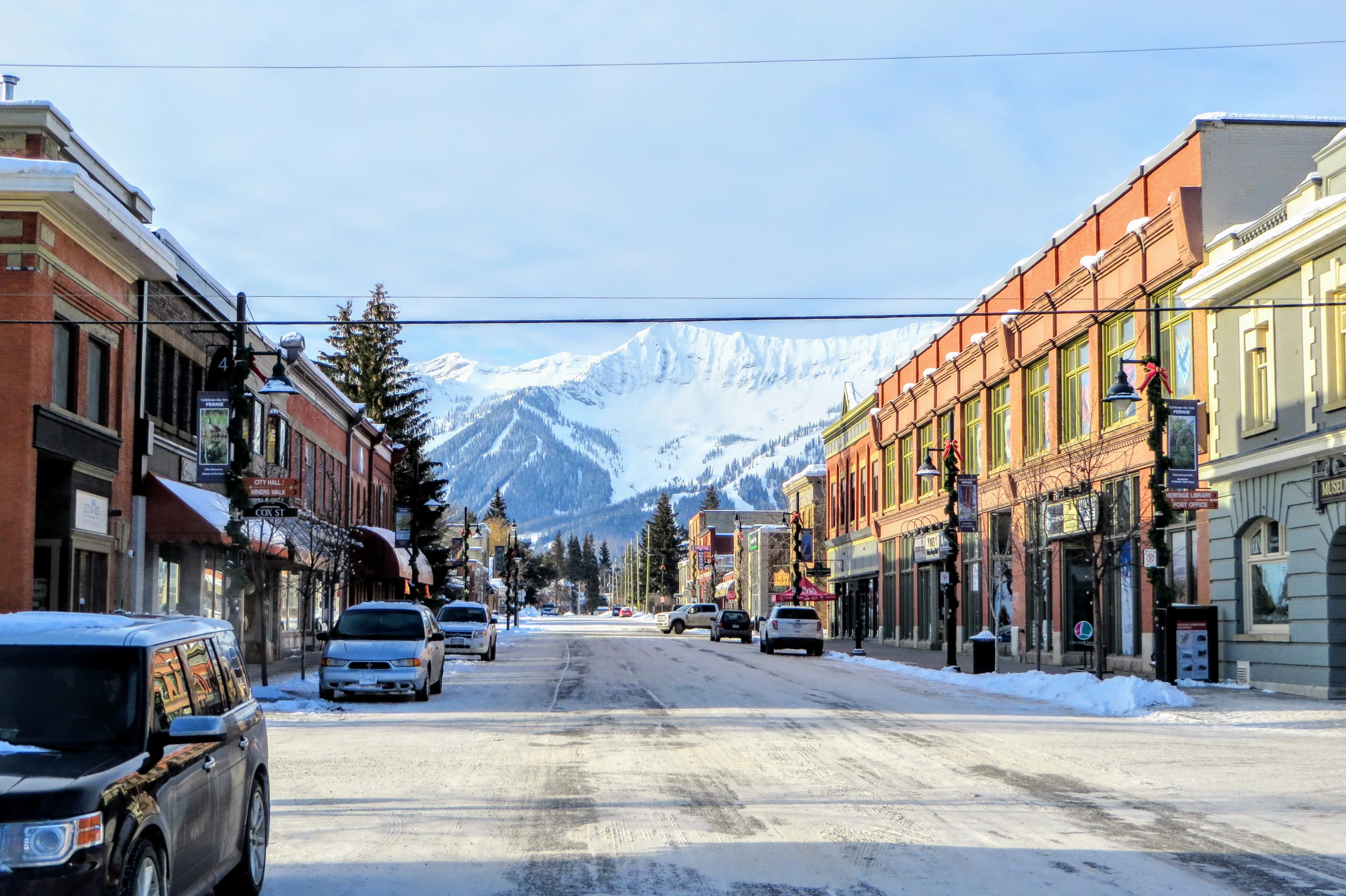 Fernie, British Columbia, Canada - February 24th, 2019: A view down the streets of downtown Fernie, British Columbia, Canada on a sunny morning during the winter. A popular ski town in the Rockies.