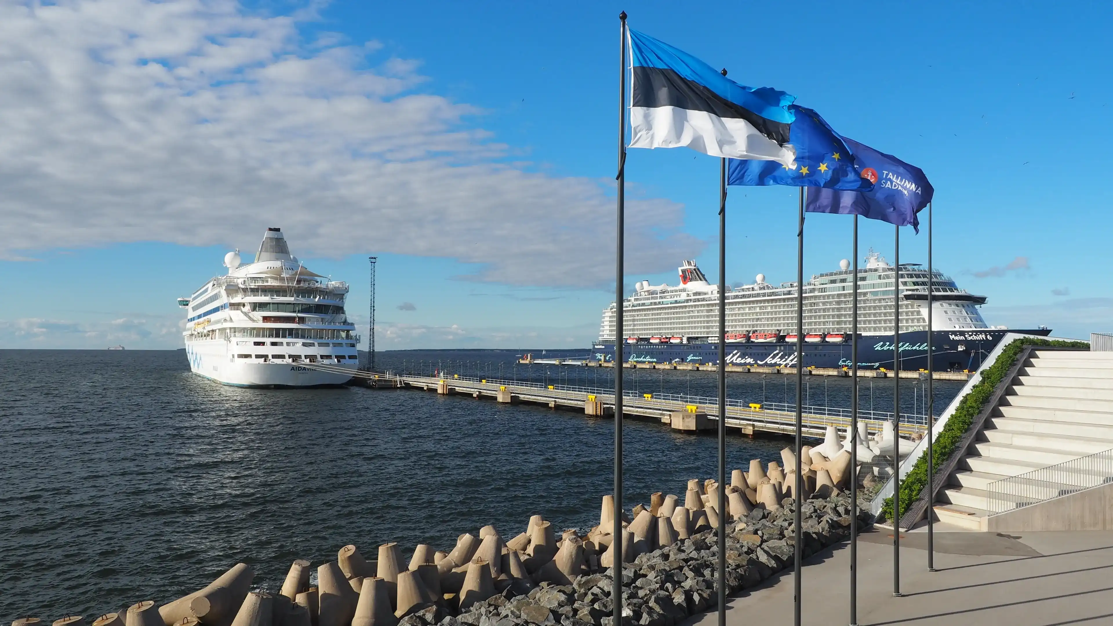 Tallinn, Estonia, 07-28-2022: sea passenger port, cruise ships at the pier, flags of Estonia, the European Union and the Port of Tallinn