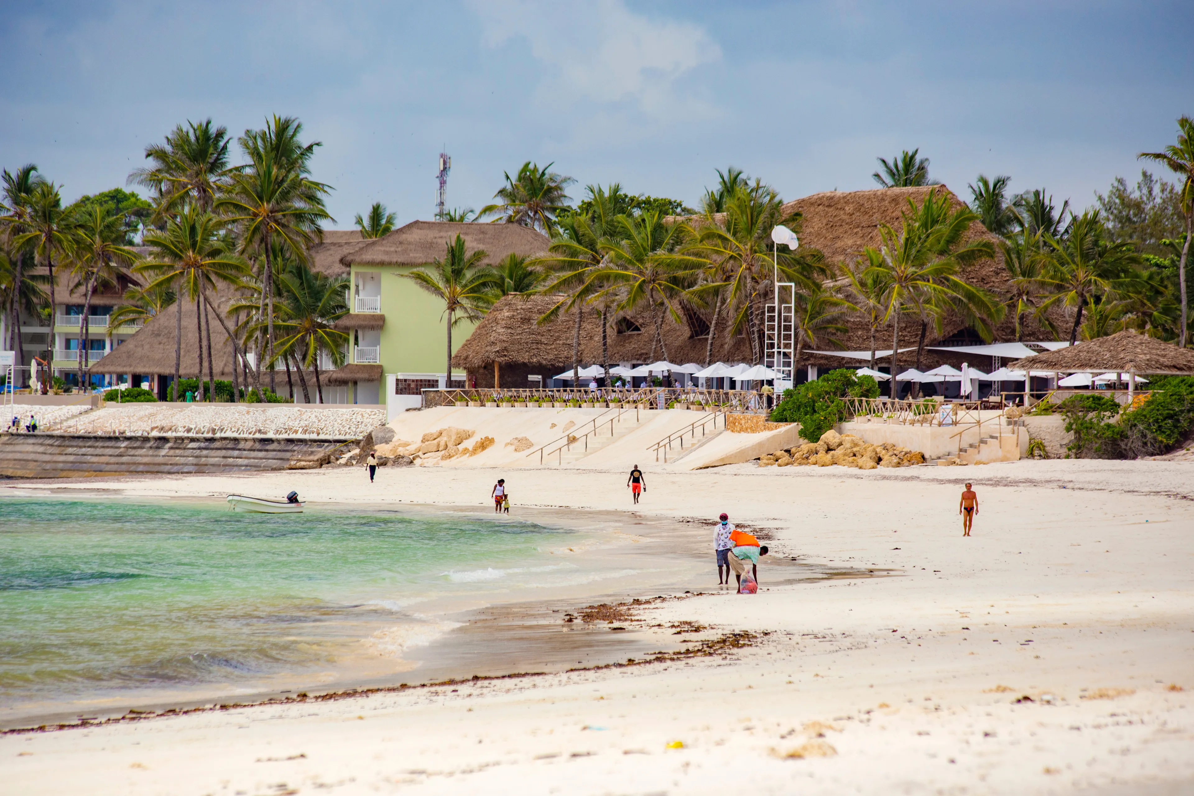 WATAMU, KENYA - December 2020: Watamu Blue Bay beach, white sandy beach, hotels, boats and people on the beach, Watamu, Kenya