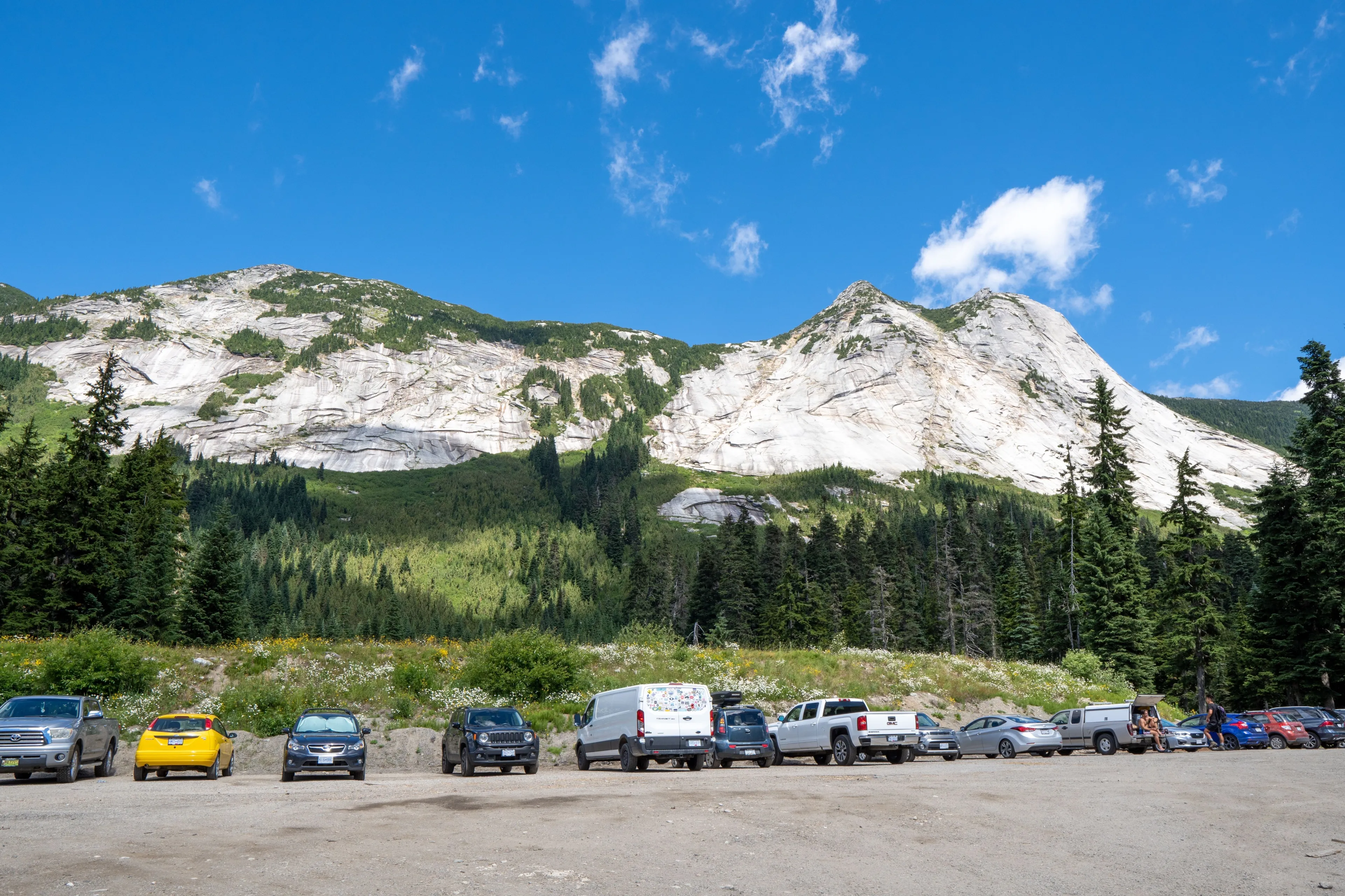 HOPE, CA - Aug 09, 2020: The vehicles stopping at Zopkios break checkpoint, near high hills with lush green forest at Coquihalla Summit, British Columbia, Canada