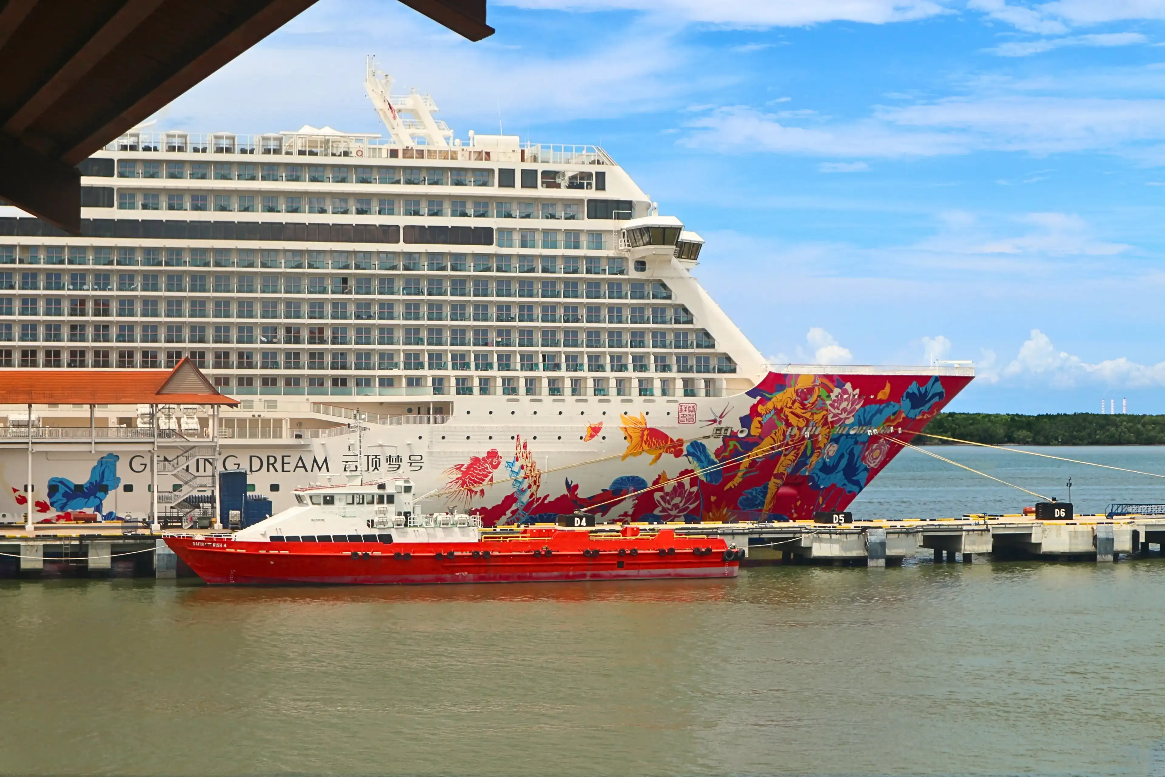 Port Klang, Malaysia - November 9th 2023: travel photography of Genting Dream cruise ship docking at Port Klang in Selangor, Malaysia Port Klang, Malaysia - November 9th 2023: travel photography of Genting Dream cruise ship docking at Port Klang in Selangor, Malaysia