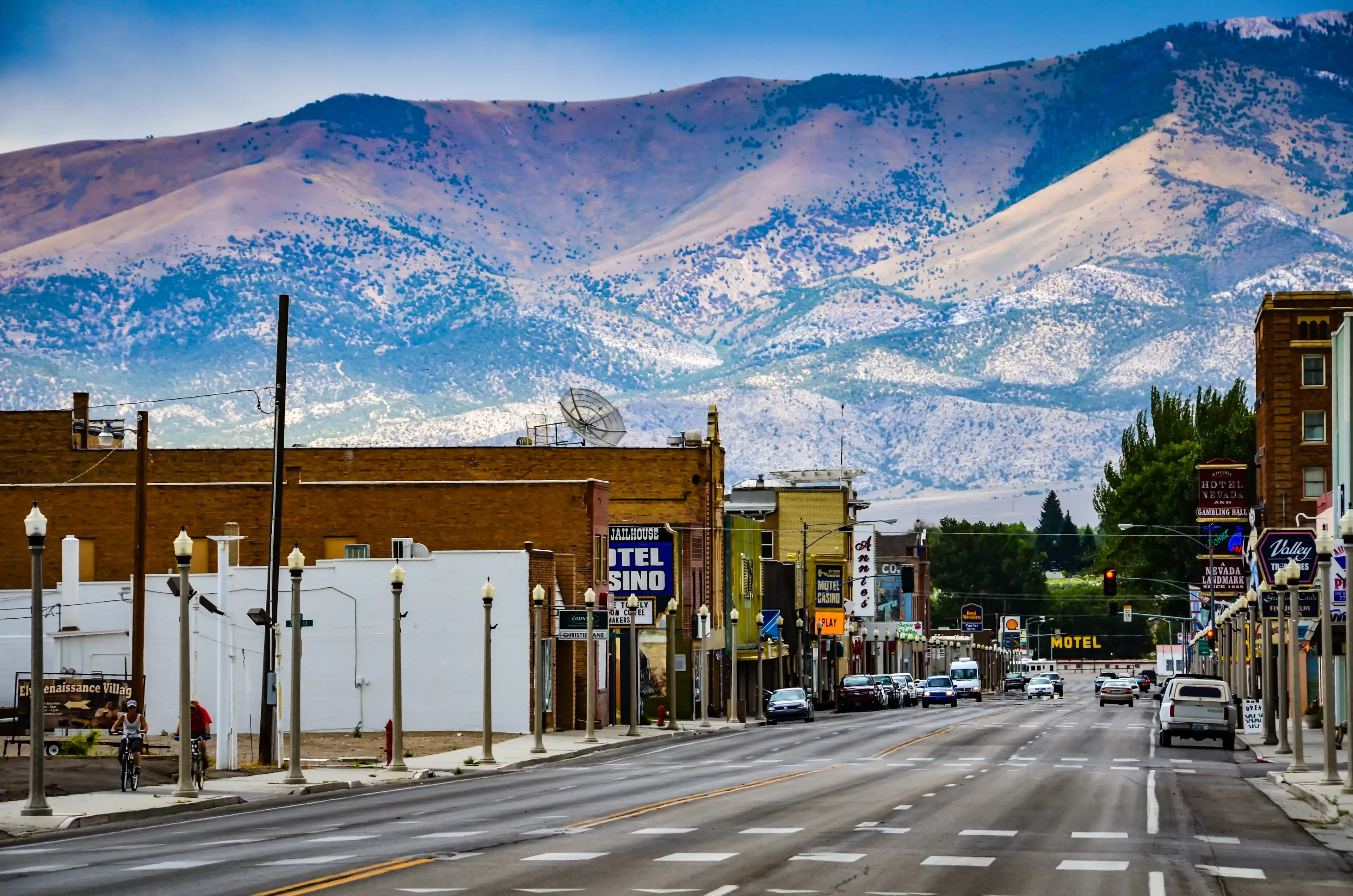 Ely, NV / USA - 08-17-2013: Route 50, the main street in western town of Ely, Nevada is seen against backdrop of mountain range. Ely, NV / USA - 08-17-2013: Route 50, the main street in western town of Ely, Nevada is seen against backdrop of mountain range.