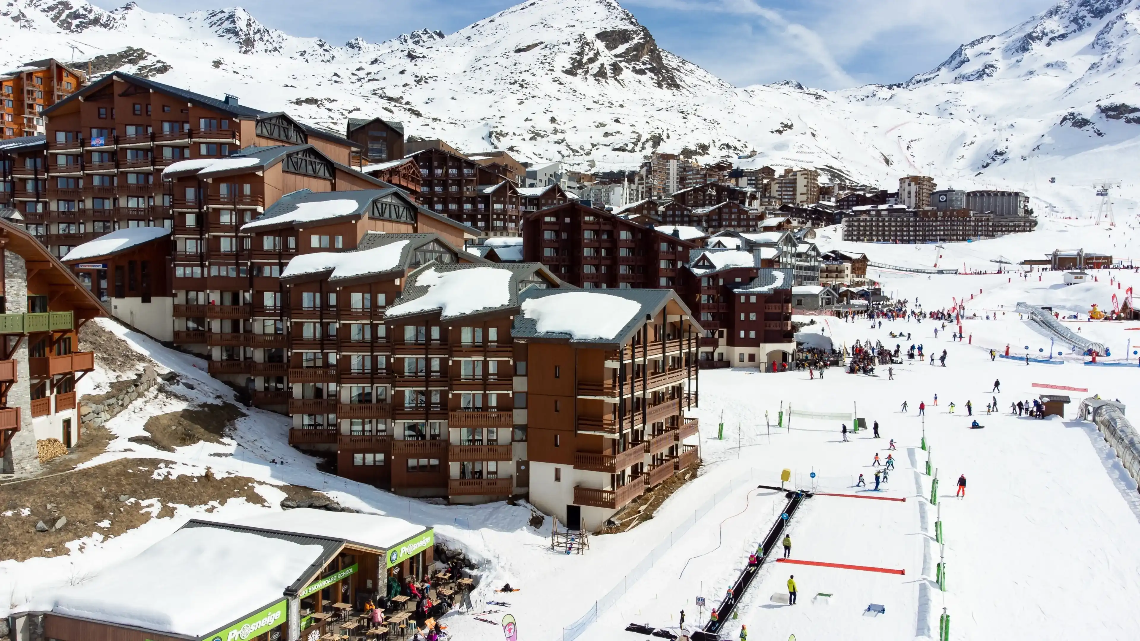 Aerial view of the snowy Val Thorens ski resort in the French Alps in winter - Luxurious hotels secluded in a white valley in altitude among high peaks and ski slopes Aerial view of the snowy Val Thorens ski resort in the French Alps in winter - Luxurious hotels secluded in a white valley in altitude among high peaks and ski slopes