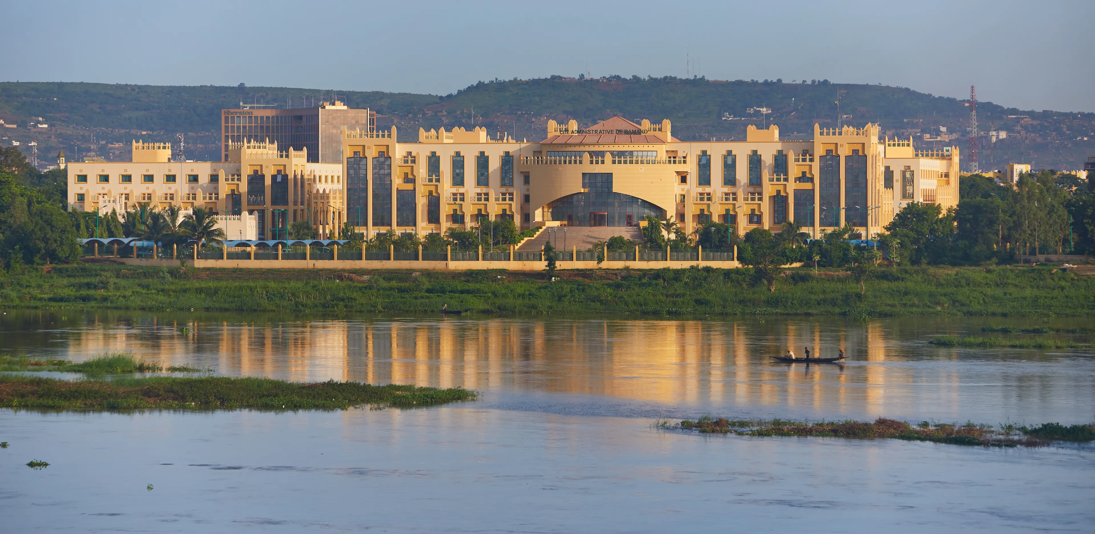 Mali, Bamako – July 08, 2018: Panoramic Niger river view onto Cite Administrative De Bamako building.