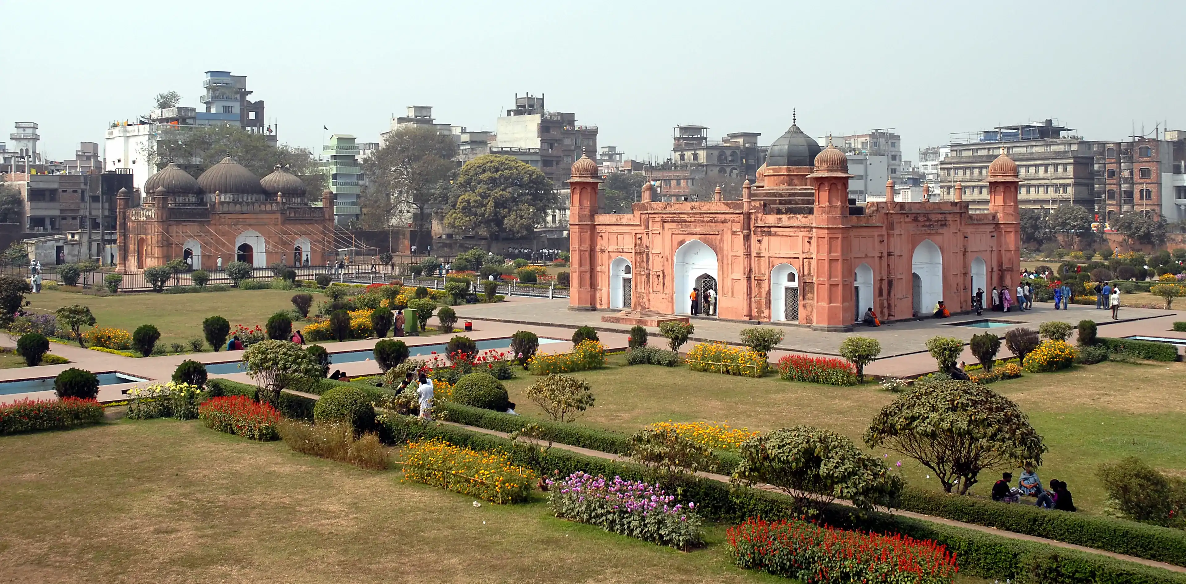 Lalbagh Fort in Dhaka, Bangladesh. This is the tomb of Bibi Pari in the grounds of Lalbagh Fort, Dhaka. To the left with three domes is Lalbagh Fort Mosque. Tourist sight in Dhaka, Bangladesh.