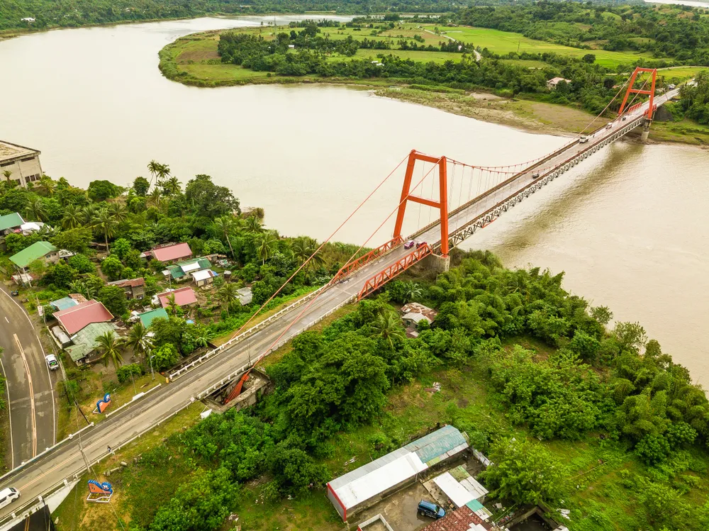 Magapit Suspension Bridge and Cagayan River, largest by volume and longest river in the Philippines.