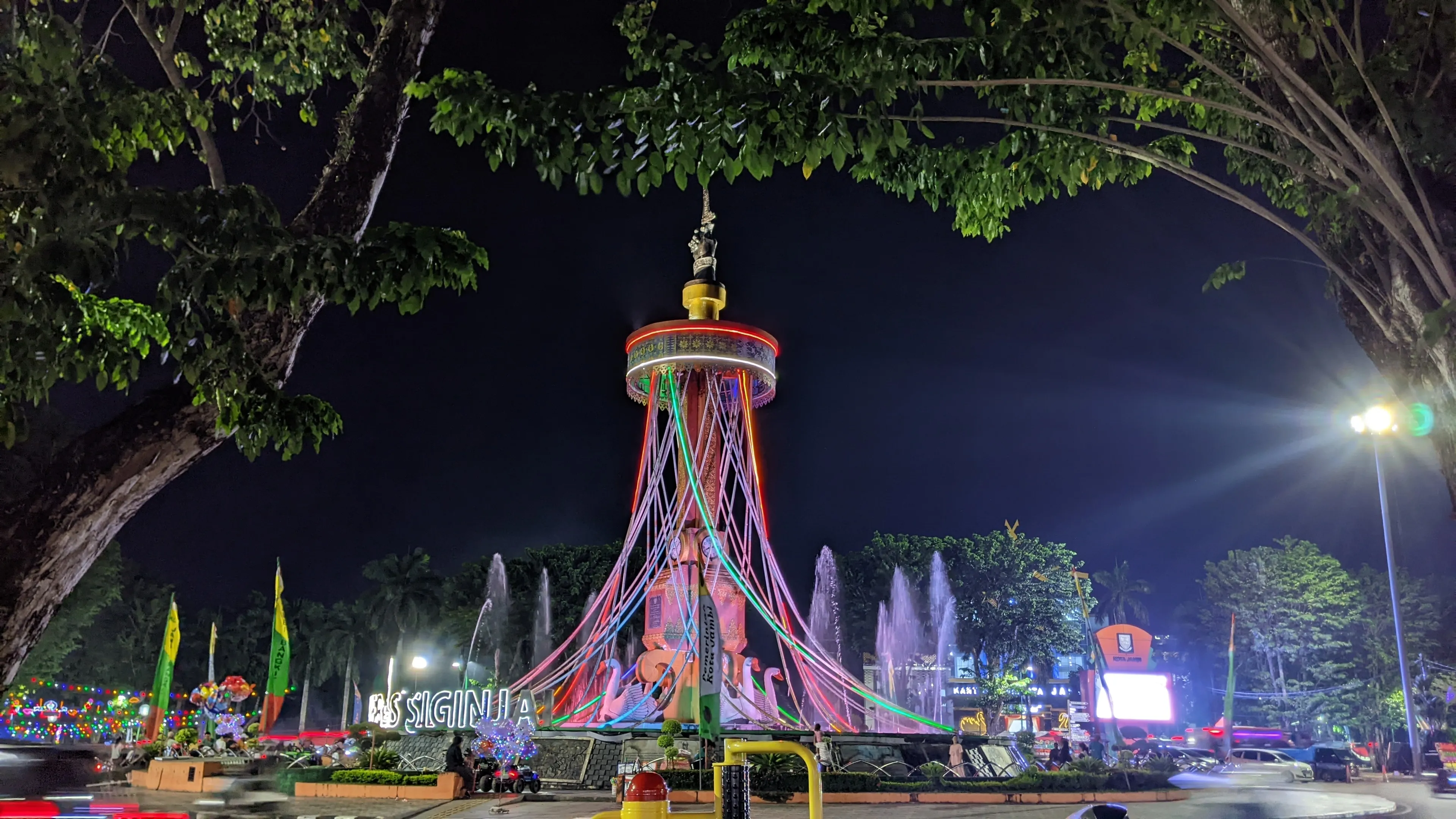 jambi, Indonesia - June 04, 2024 : Siginjai keris monument, the pride of Jambi city residents, taken from a flat angle at night
