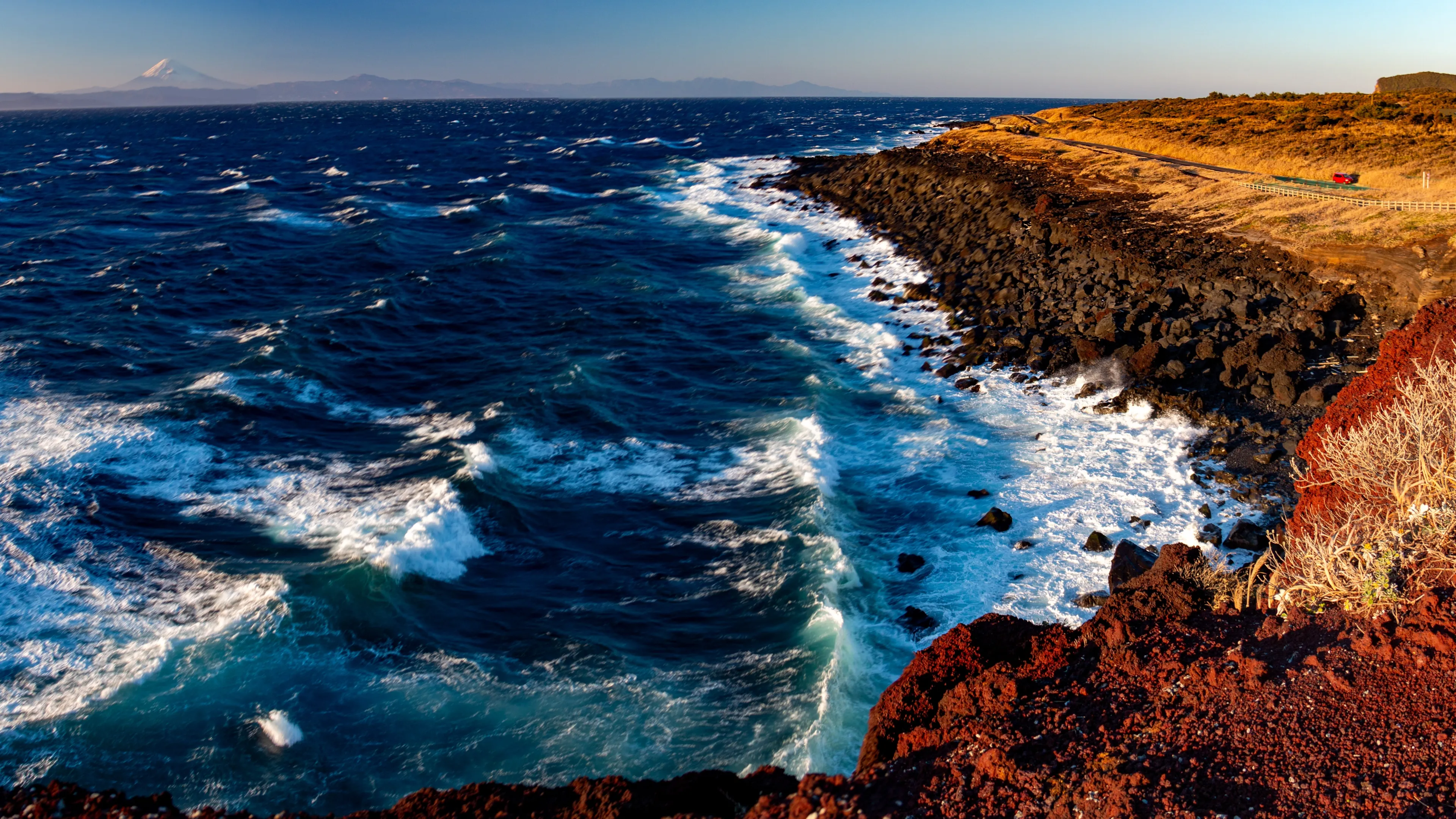Winter in Izu Oshima island - Spectacular view of Mt.Fuji across the sea dyed by the setting sun, tokyo , japan