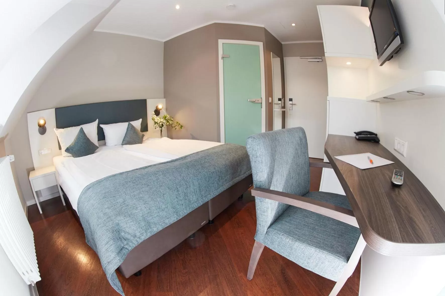 Photo of the whole room, Bed in Stadthotel Freiburg Kolping Hotels & Resorts