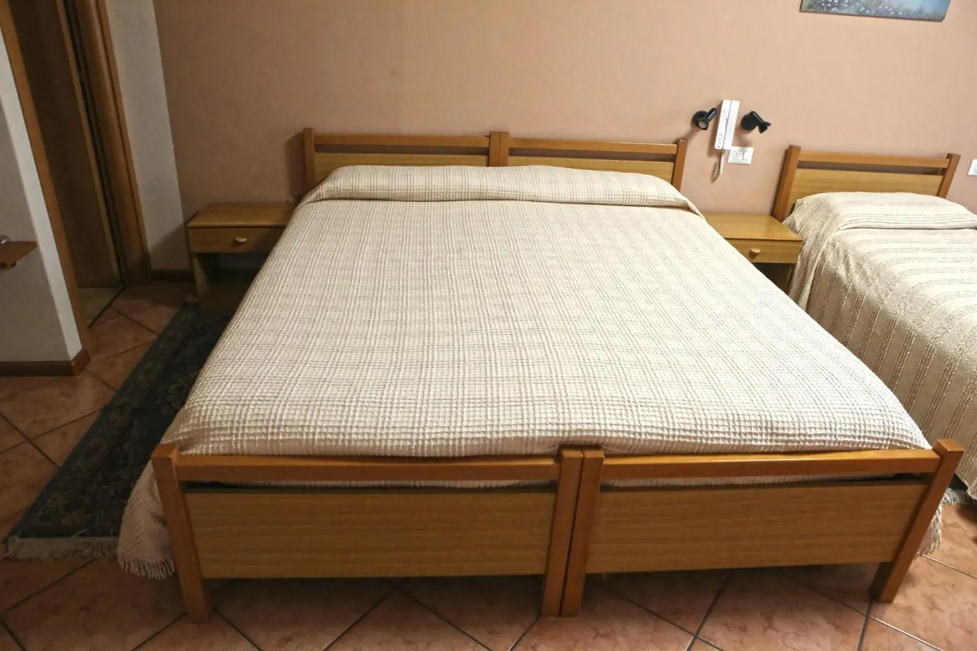 Bed in Albergo Gusmeroli