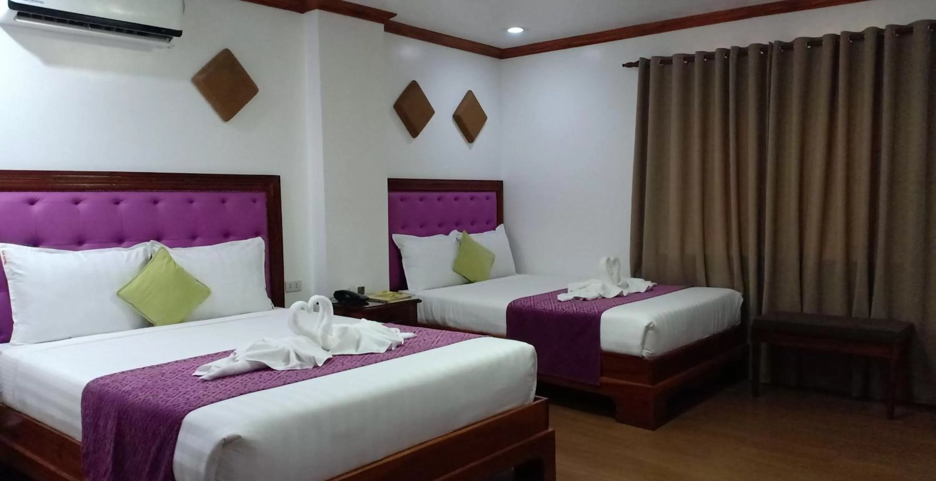 Bed in CLN Boutique Hotel