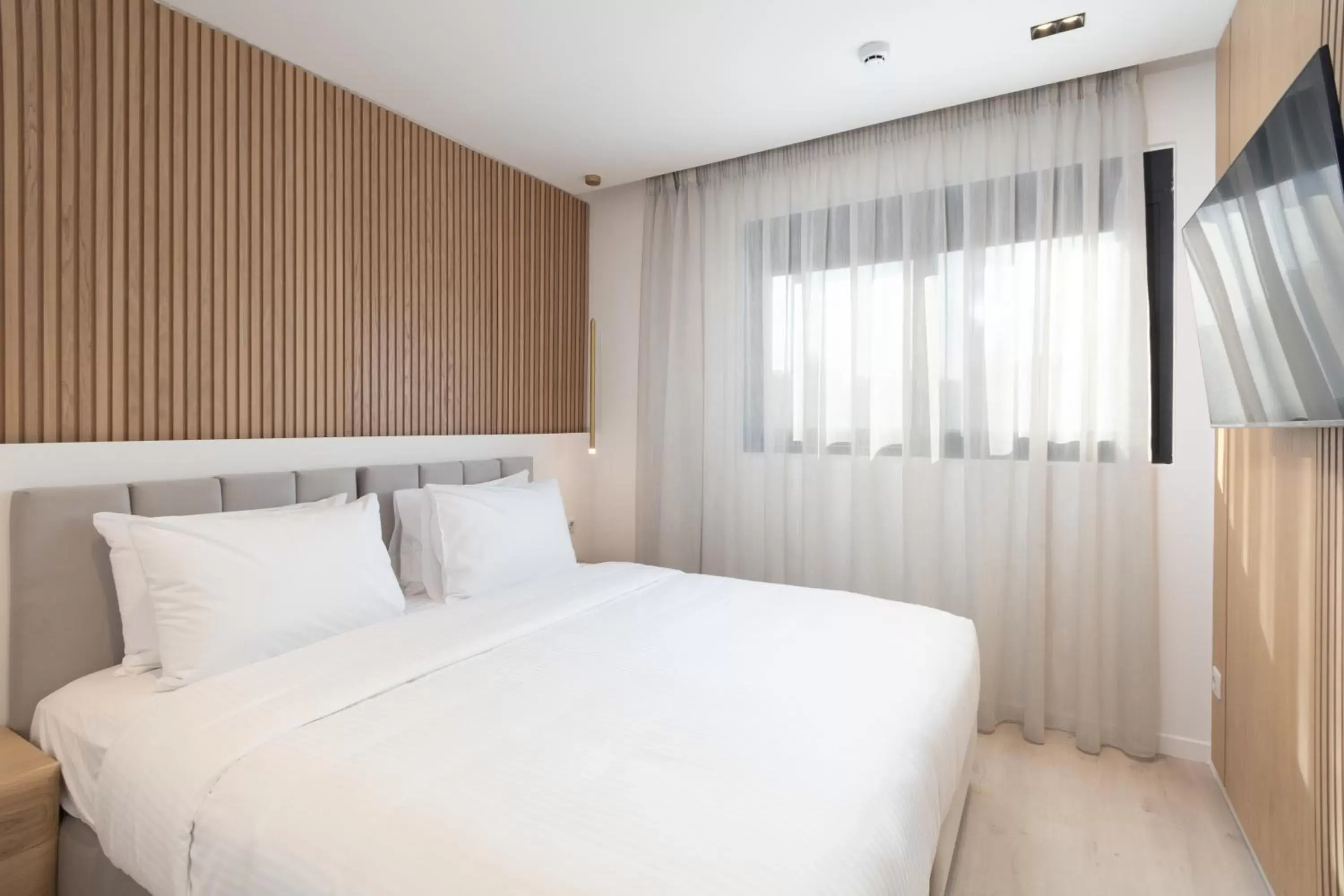 Bed in LUX&EASY Athens Metro Suites