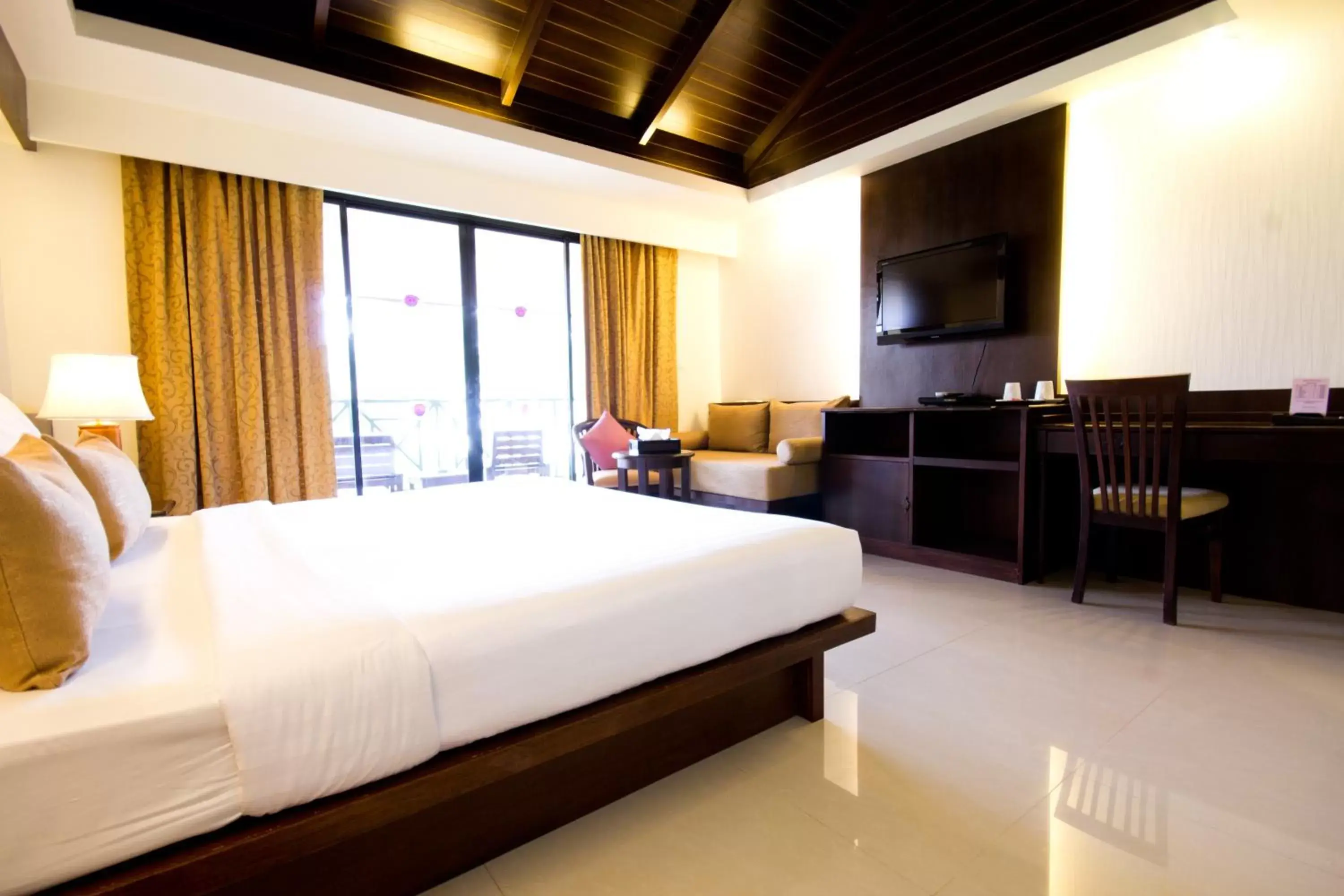 Bed in Khaolak Orchid Beach Resort - SHA Extra Plus