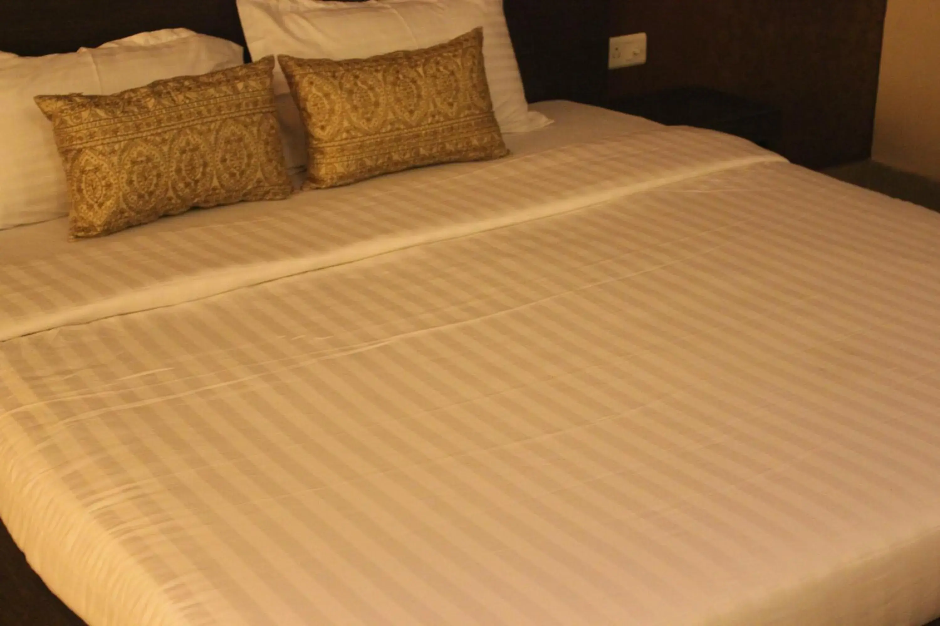 Bed in Hotel Savi Regency