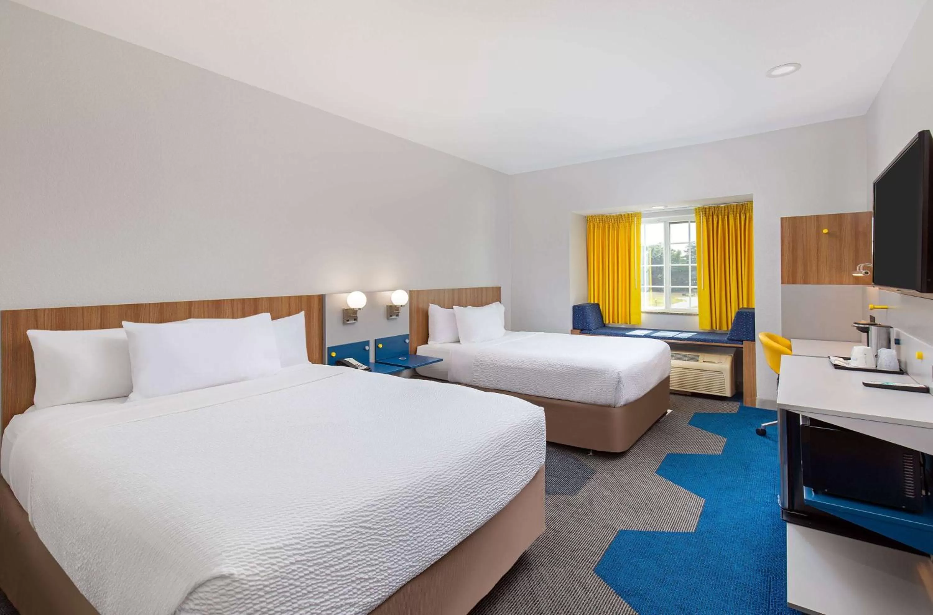 Bed in Microtel Inn and Suites by Wyndham