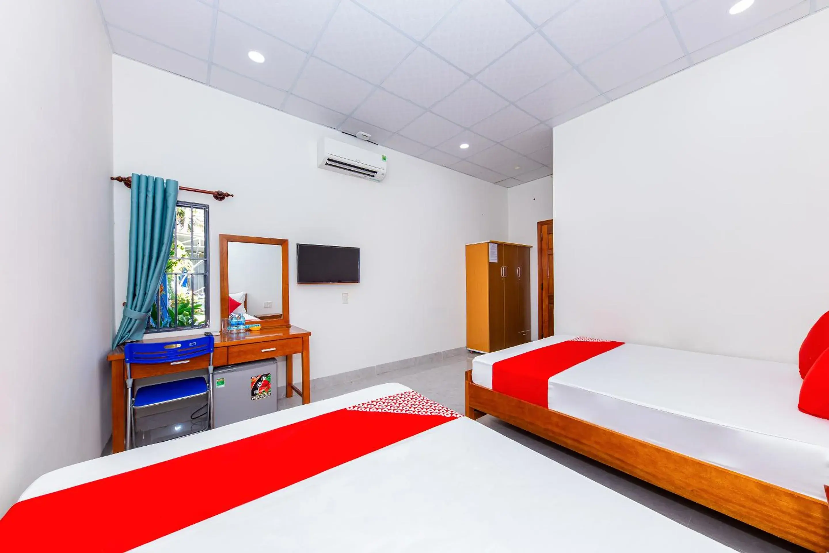 Photo of the whole room, TV/Entertainment Center in OYO 745 Minh Duc Guest House