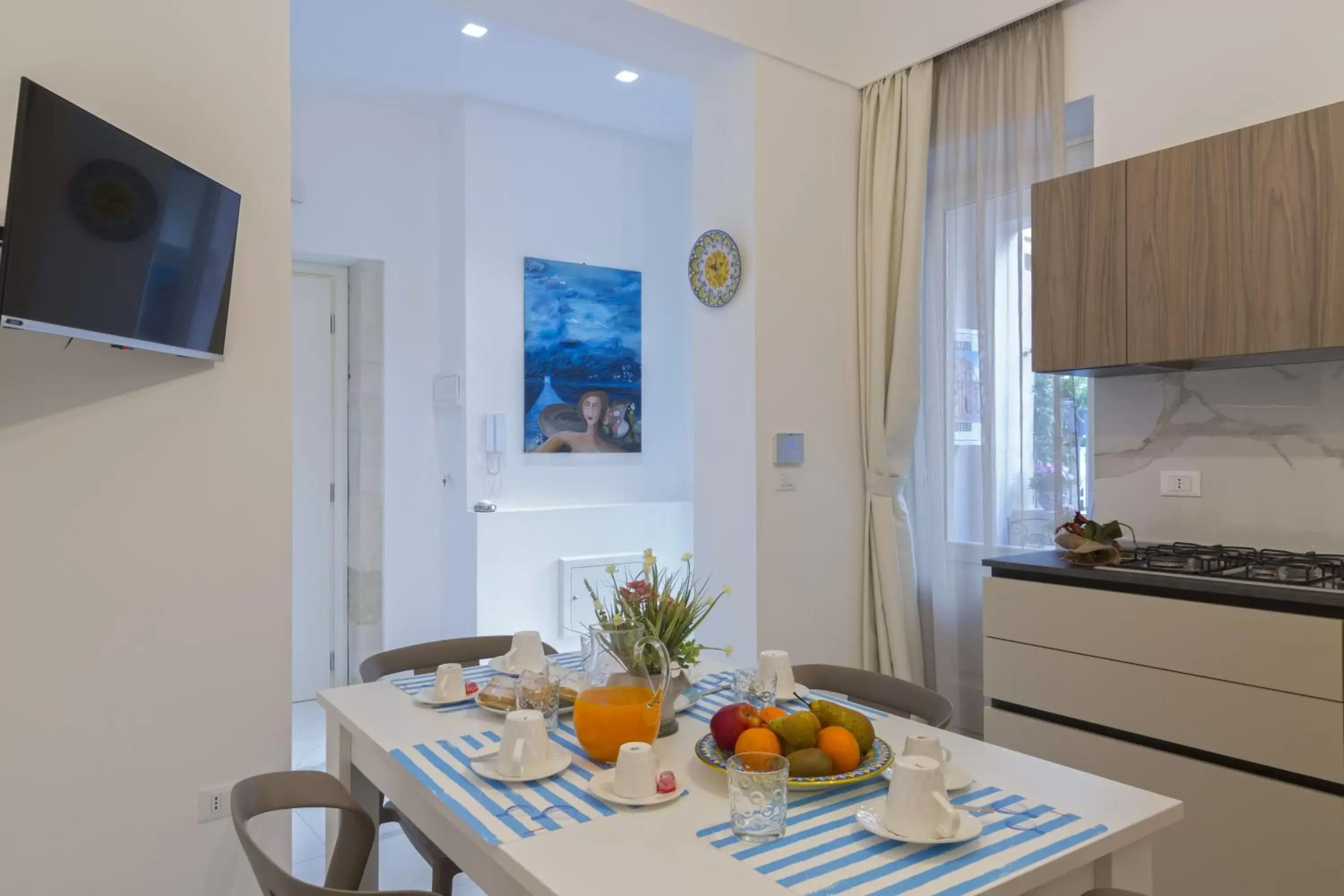 TV and multimedia, Dining Area in Corinzia Casa Vacanze