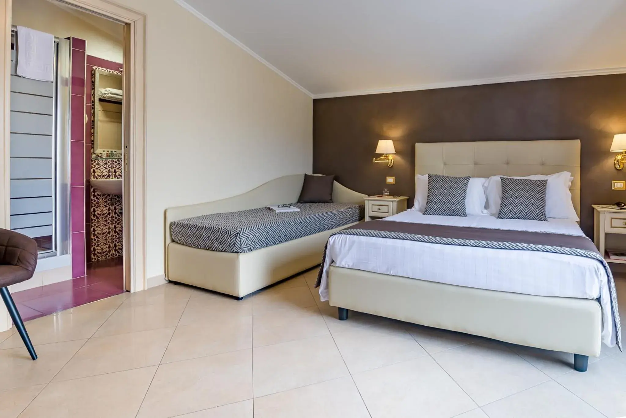 Bed in Vittorio Emanuele Boutique Hotel