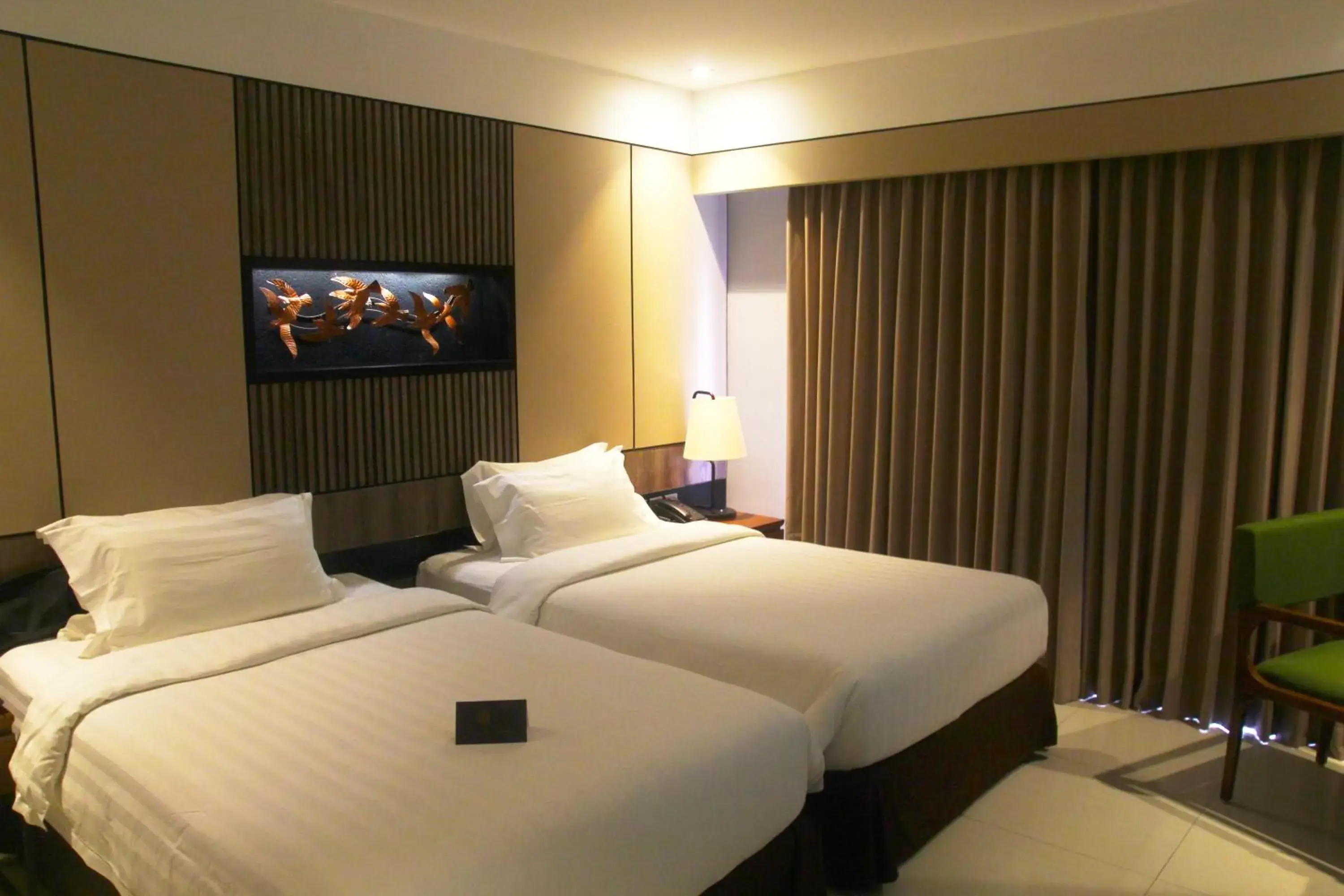 Bed in The Nest Hotel Nusa Dua