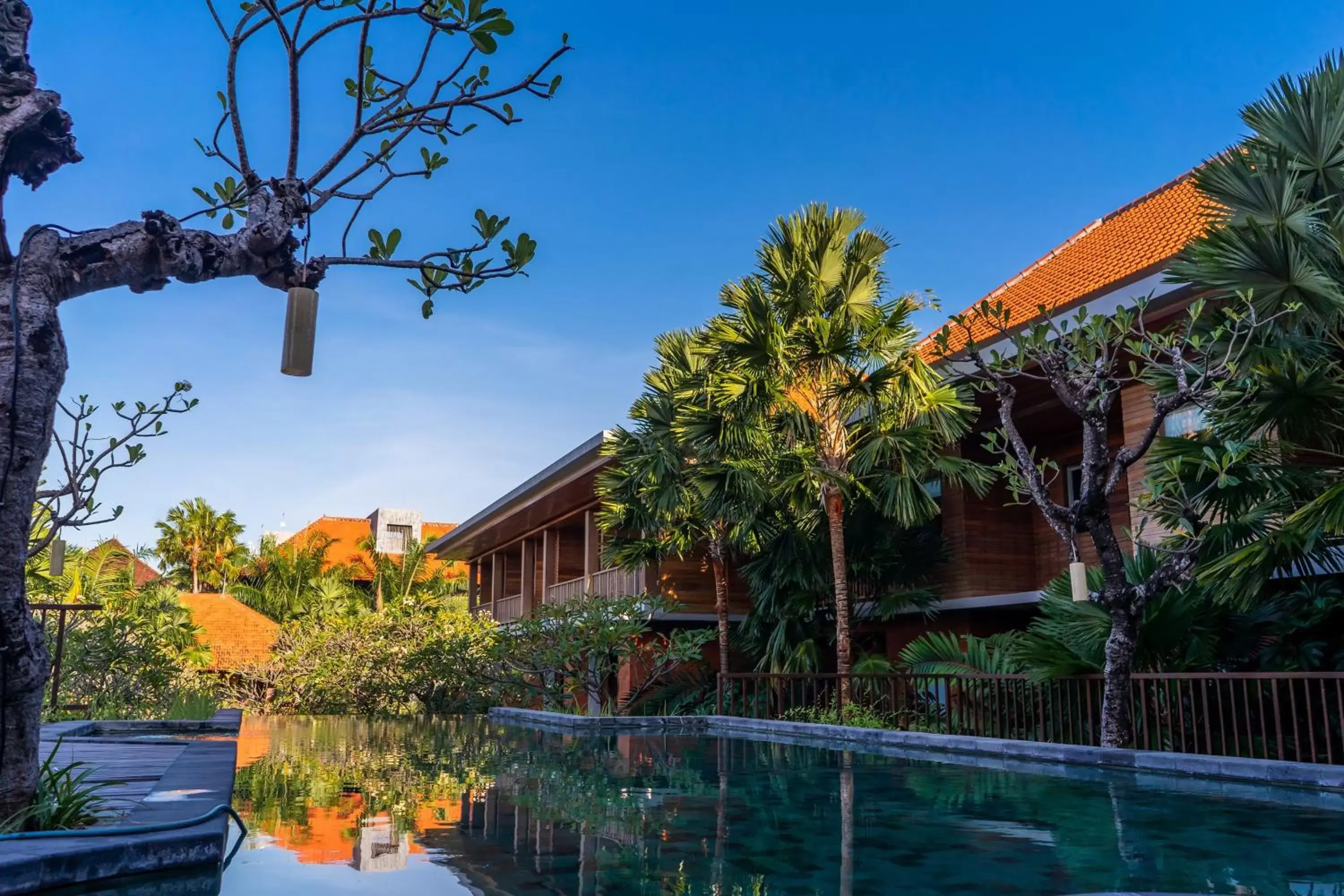 Swimming pool, Property Building in Fourteen Roses Boutique Hotel, Kuta