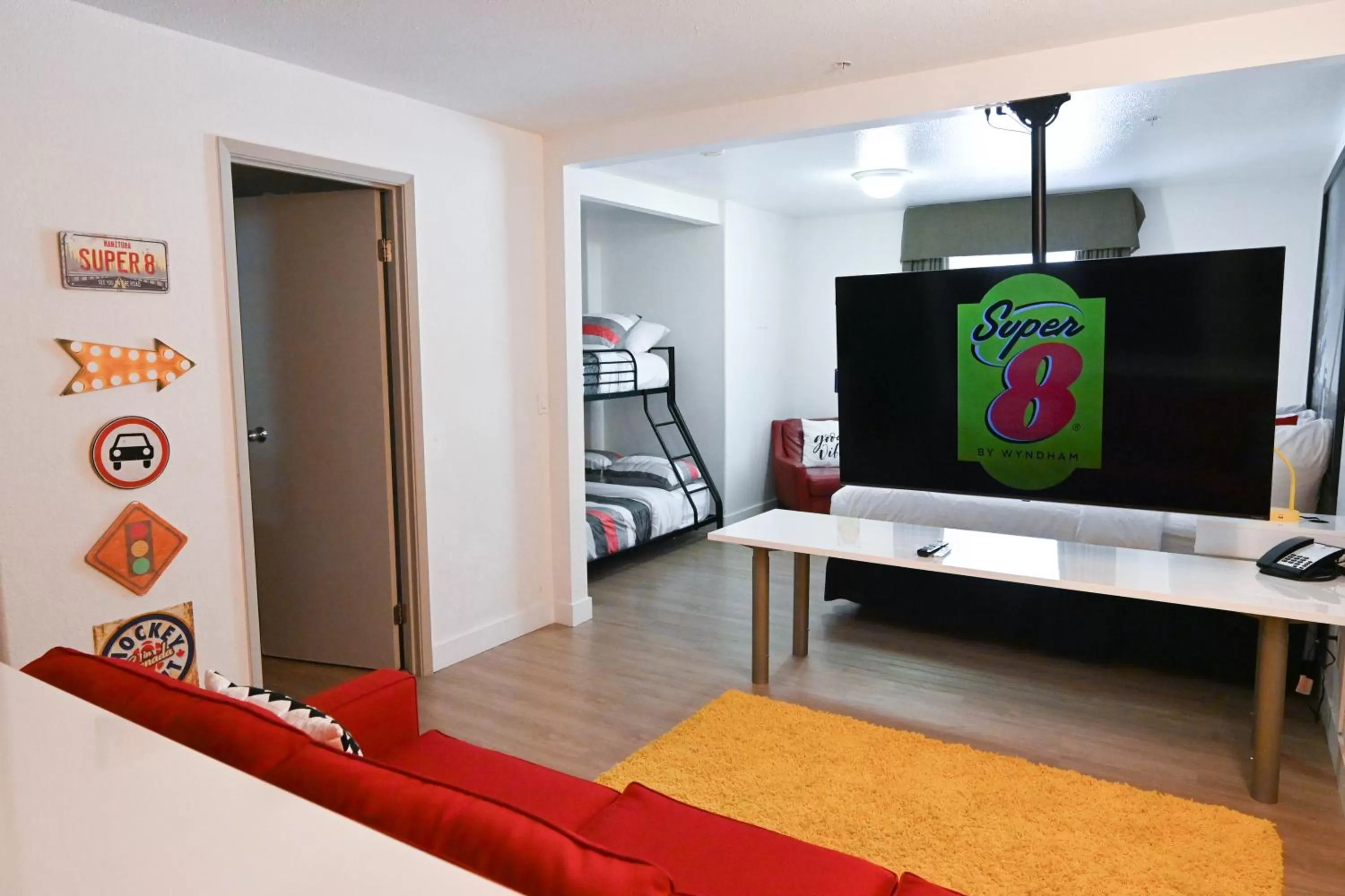 Communal lounge/ TV room in Super 8 by Wyndham Calgary Shawnessy Area
