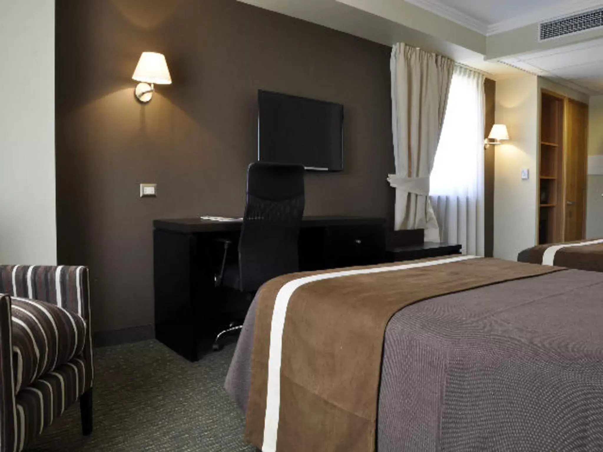 Bed, TV/Entertainment Center in Hotel Diego de Almagro Alto el Loa Calama