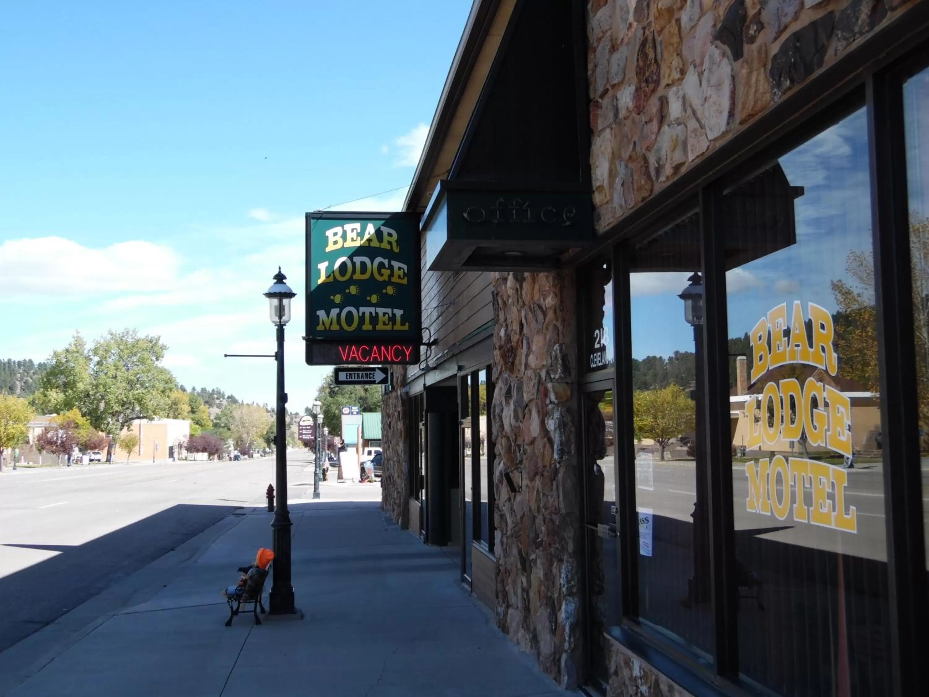 Property logo or sign in Bear Lodge Motel