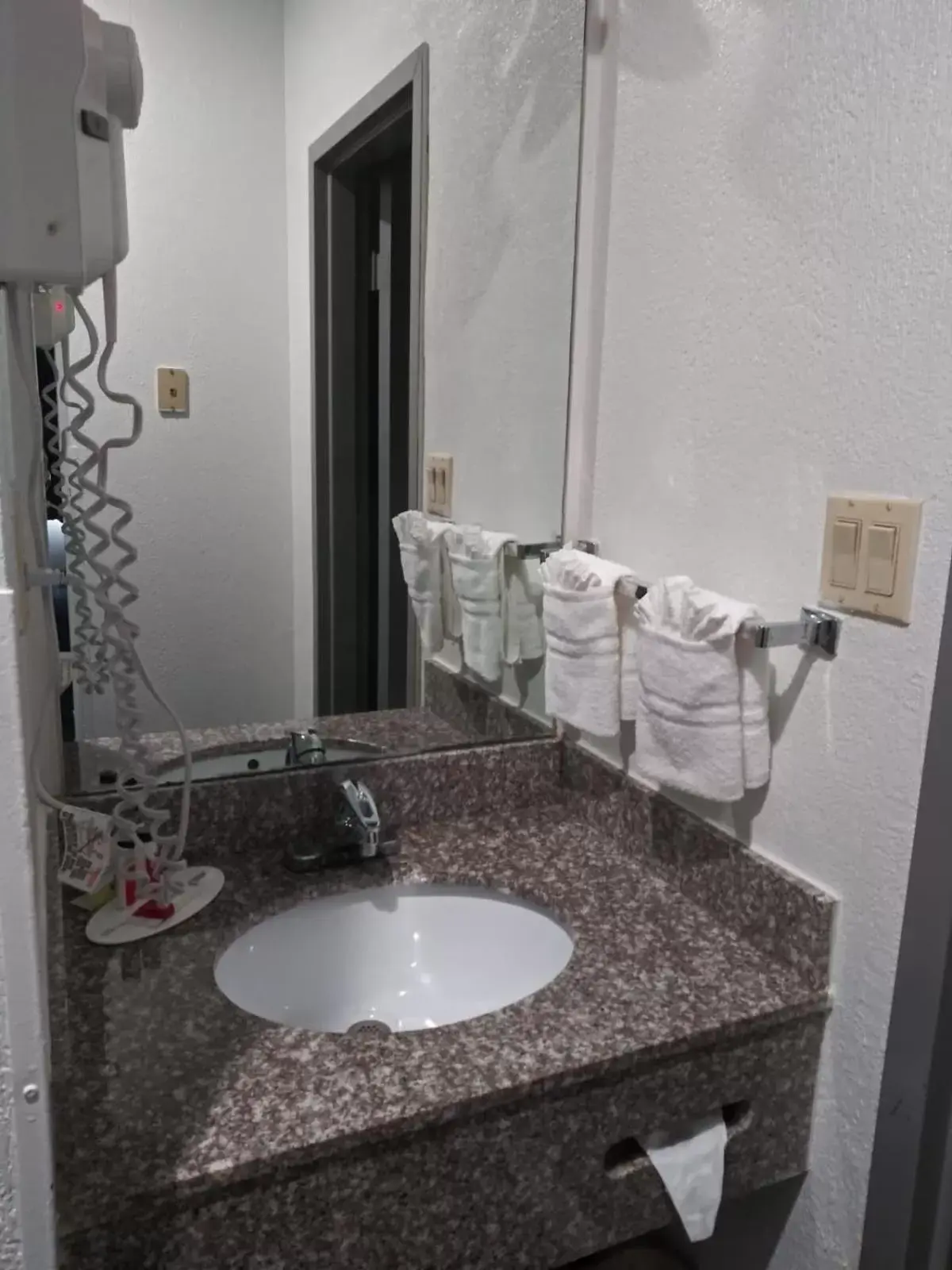 Bathroom in Days Inn & Suites by Wyndham Webster NASA-ClearLake-Houston