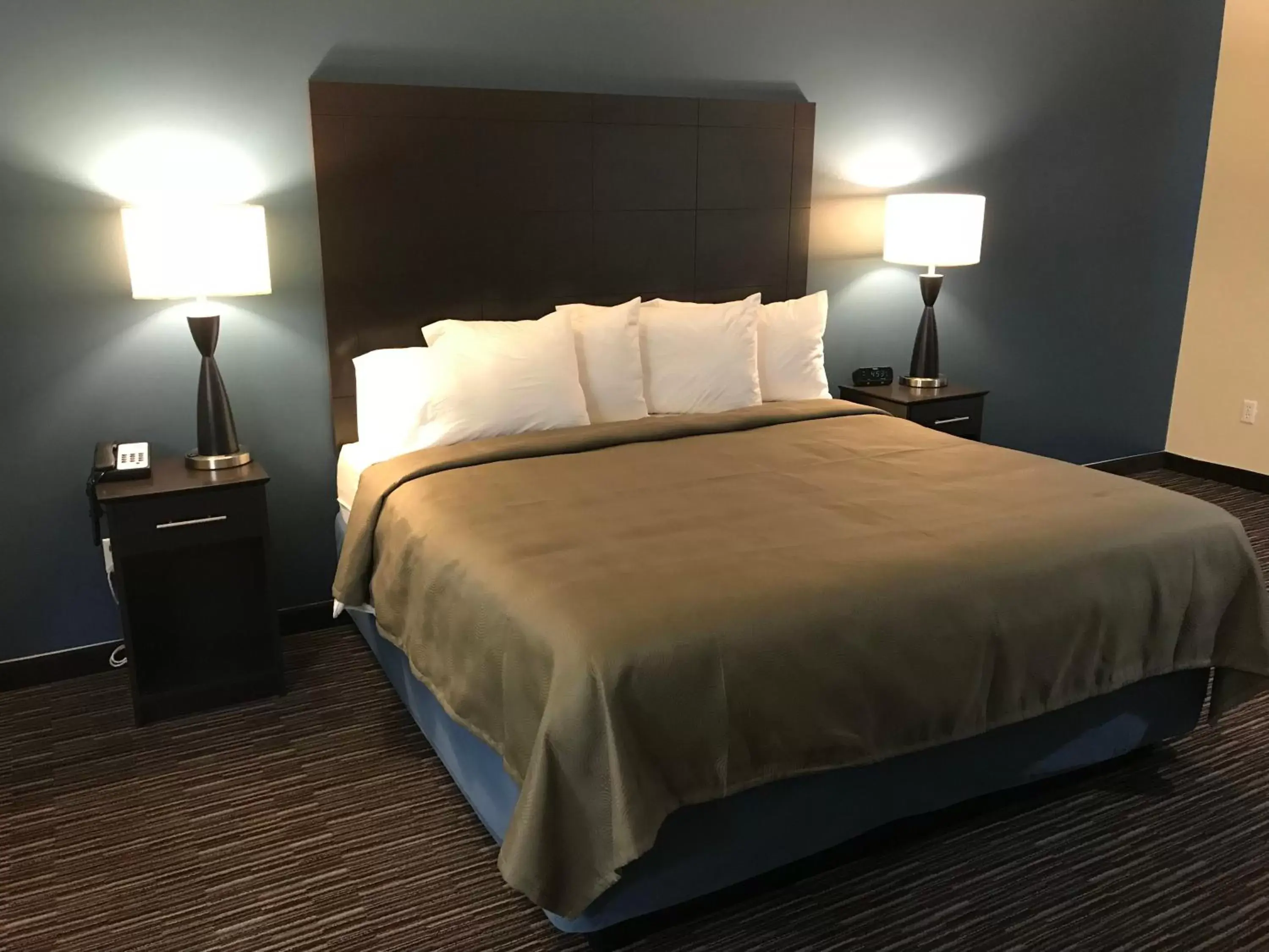 Bed in AmericInn by Wyndham Jefferson