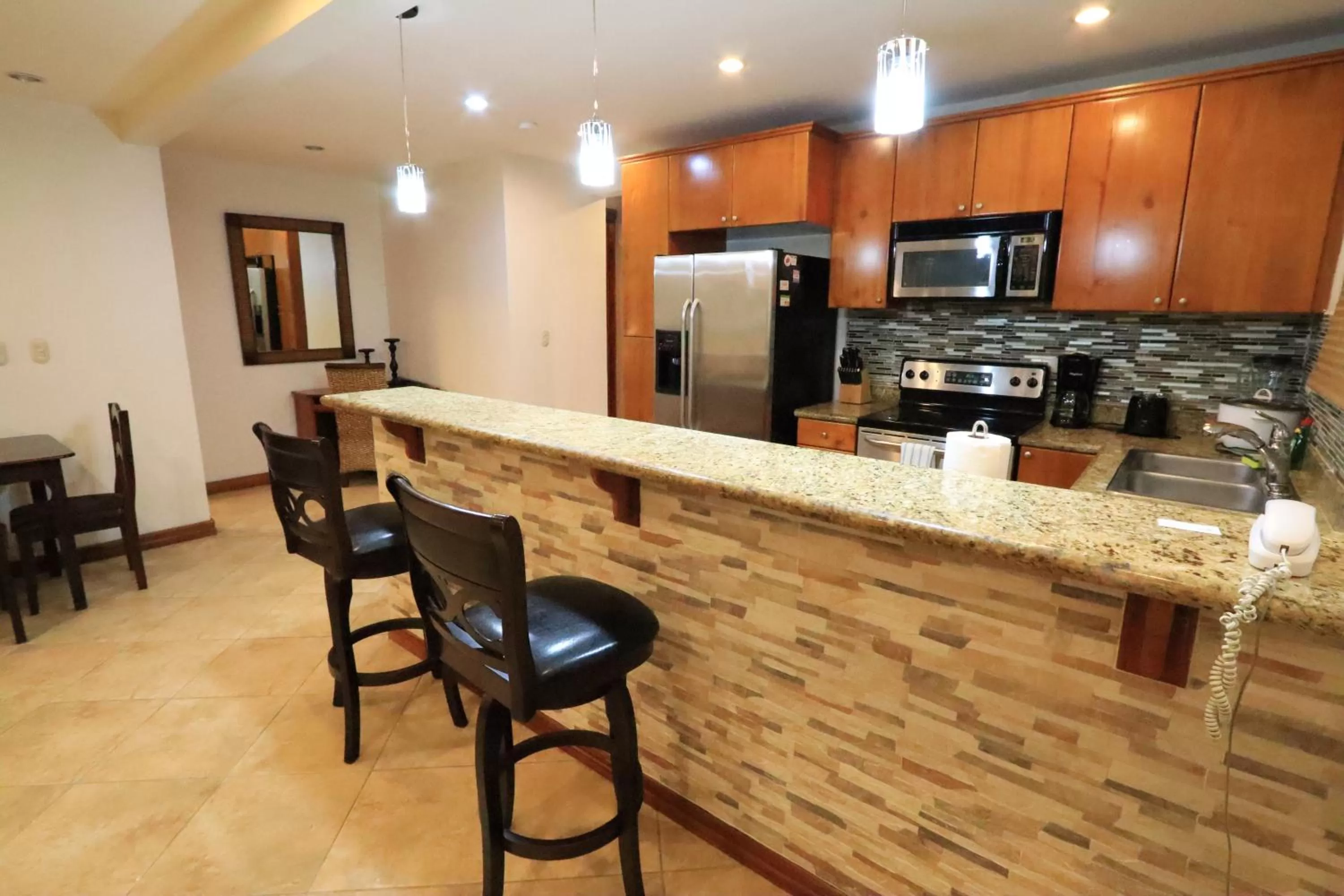 Kitchen or kitchenette in Monte Carlo Luxury Condominiums