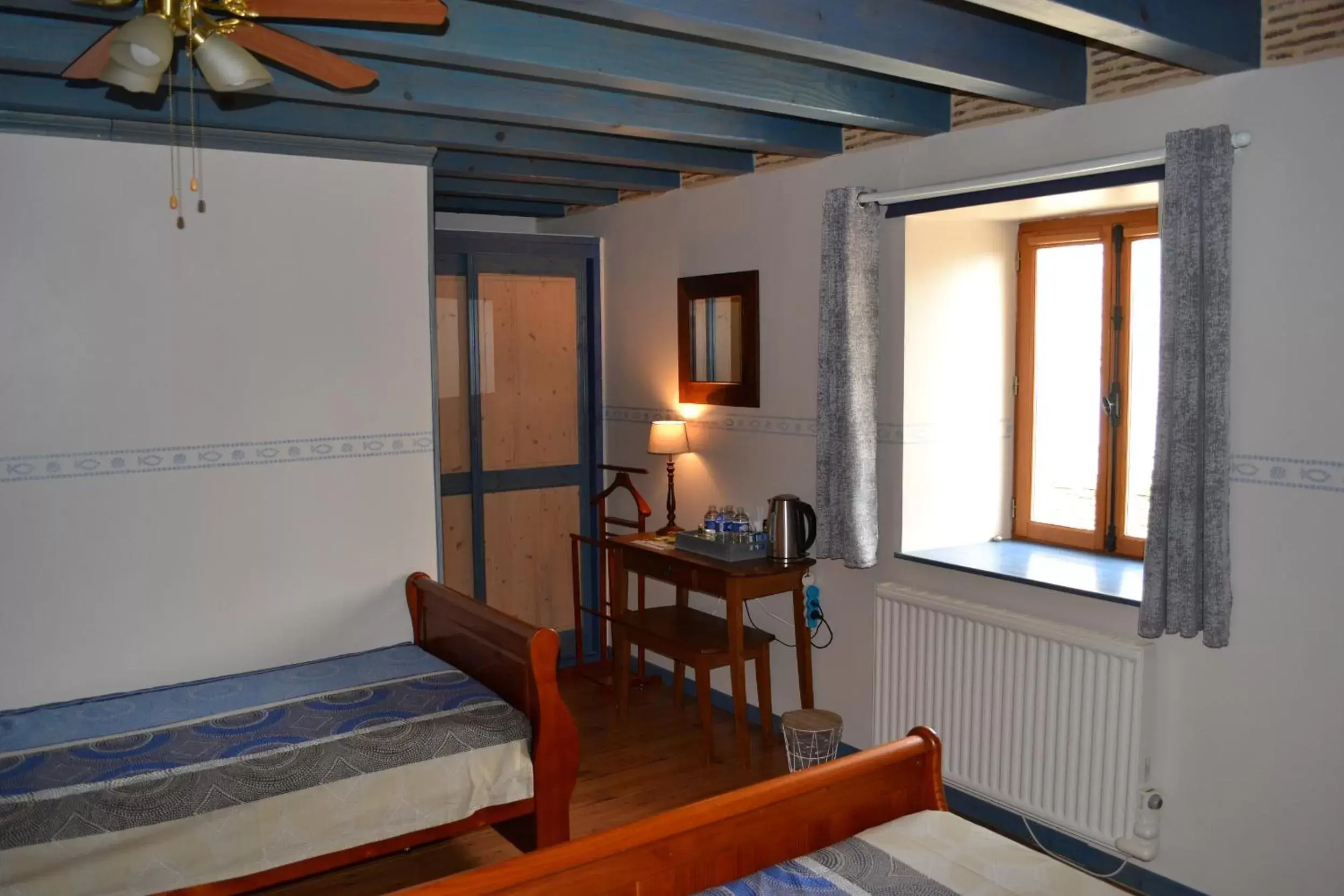 Bedroom in Chambres d'Hôtes Le Moulin à Epices