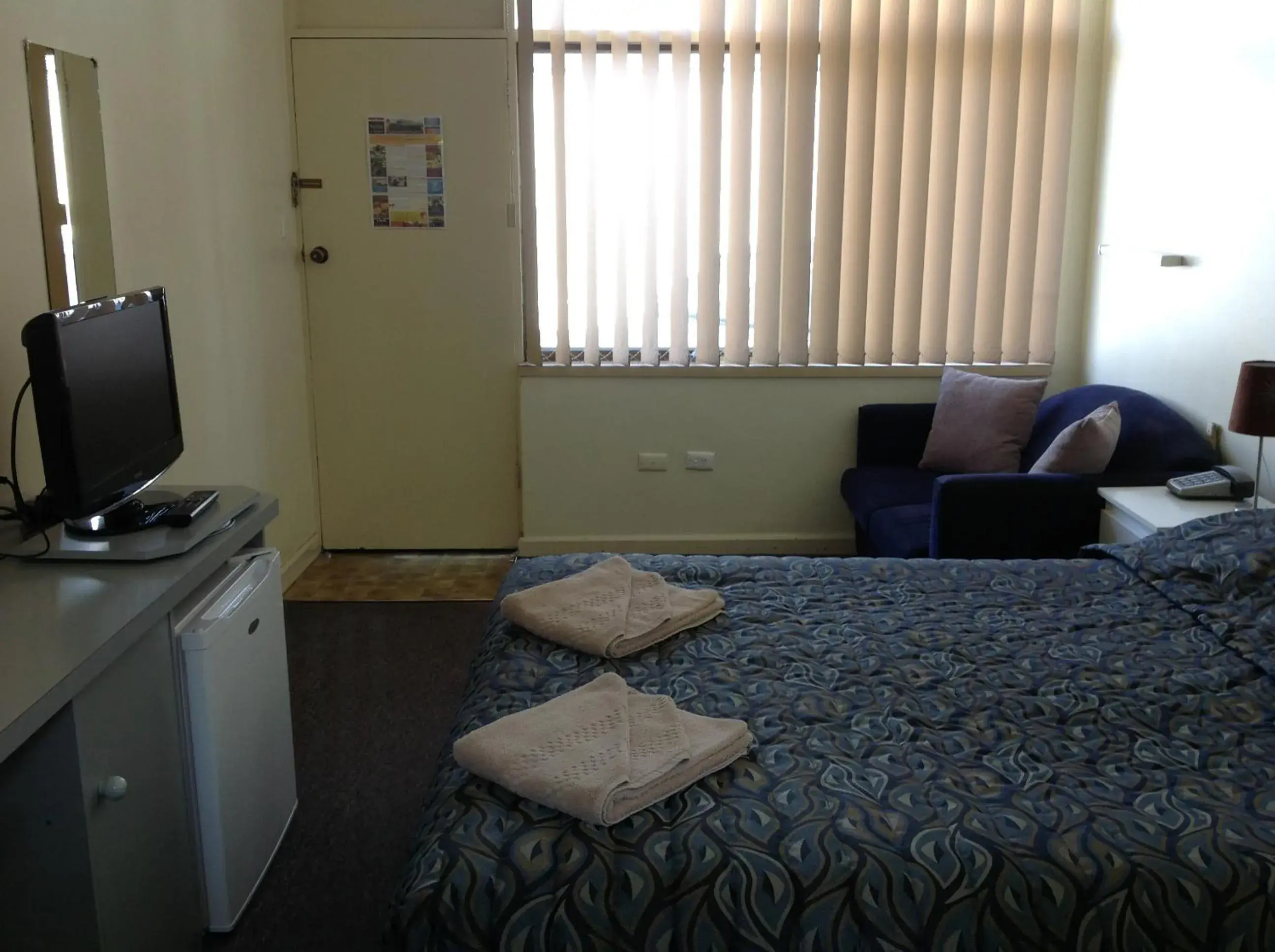 Photo of the whole room, TV/Entertainment Center in Grand Central Motel