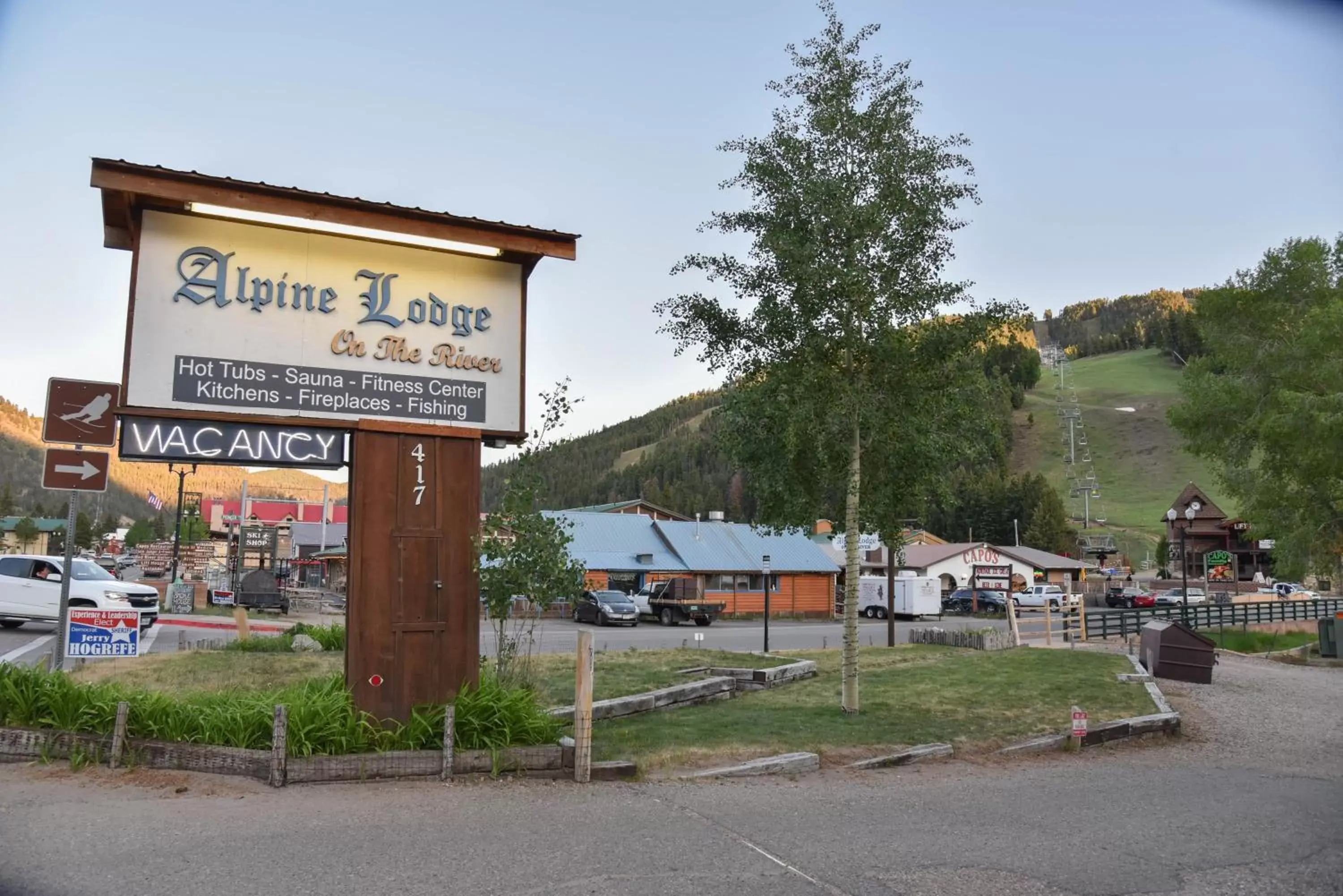 Property logo or sign in Alpine Lodge Red River