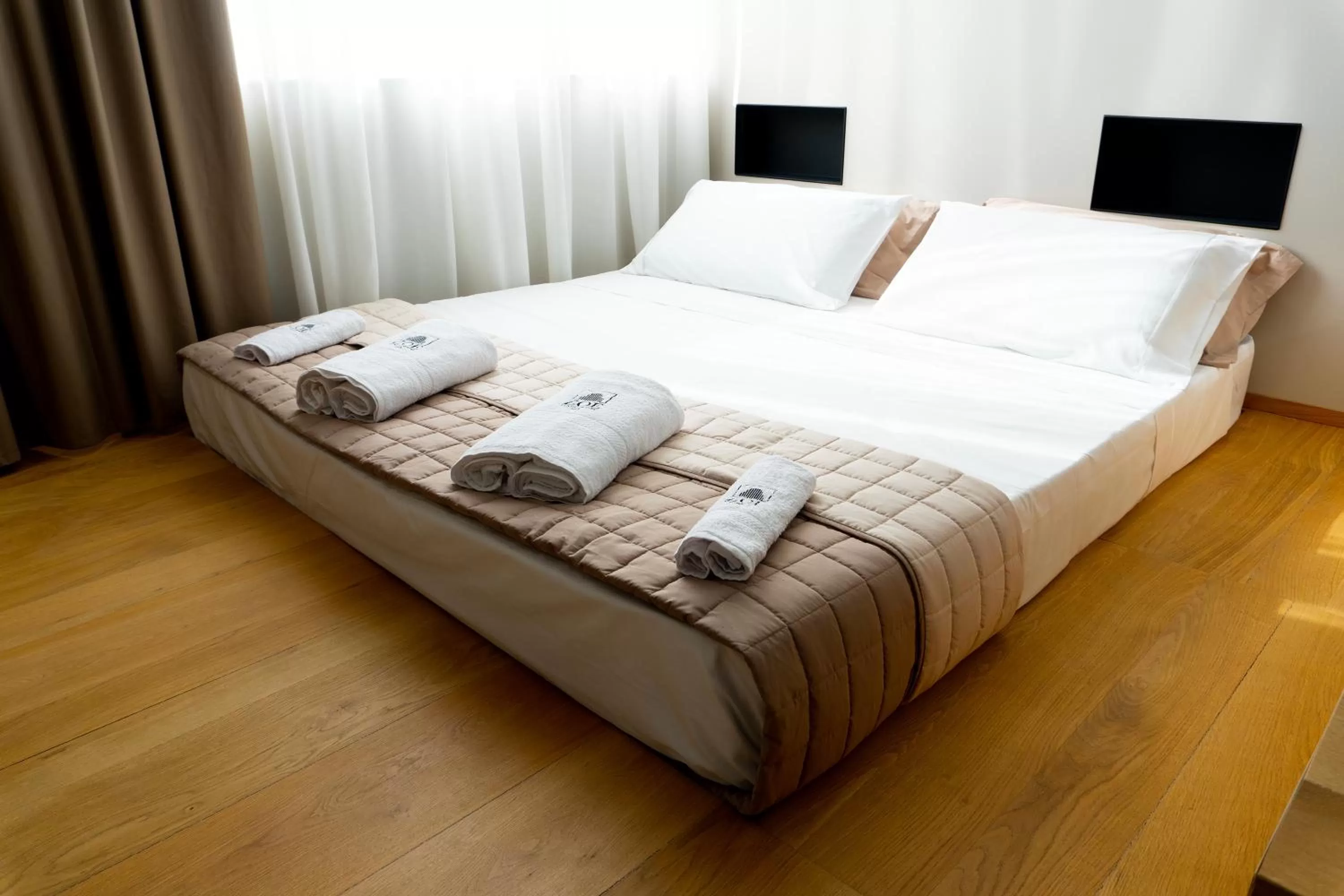 Bed in ZOE LUXURY SUITES