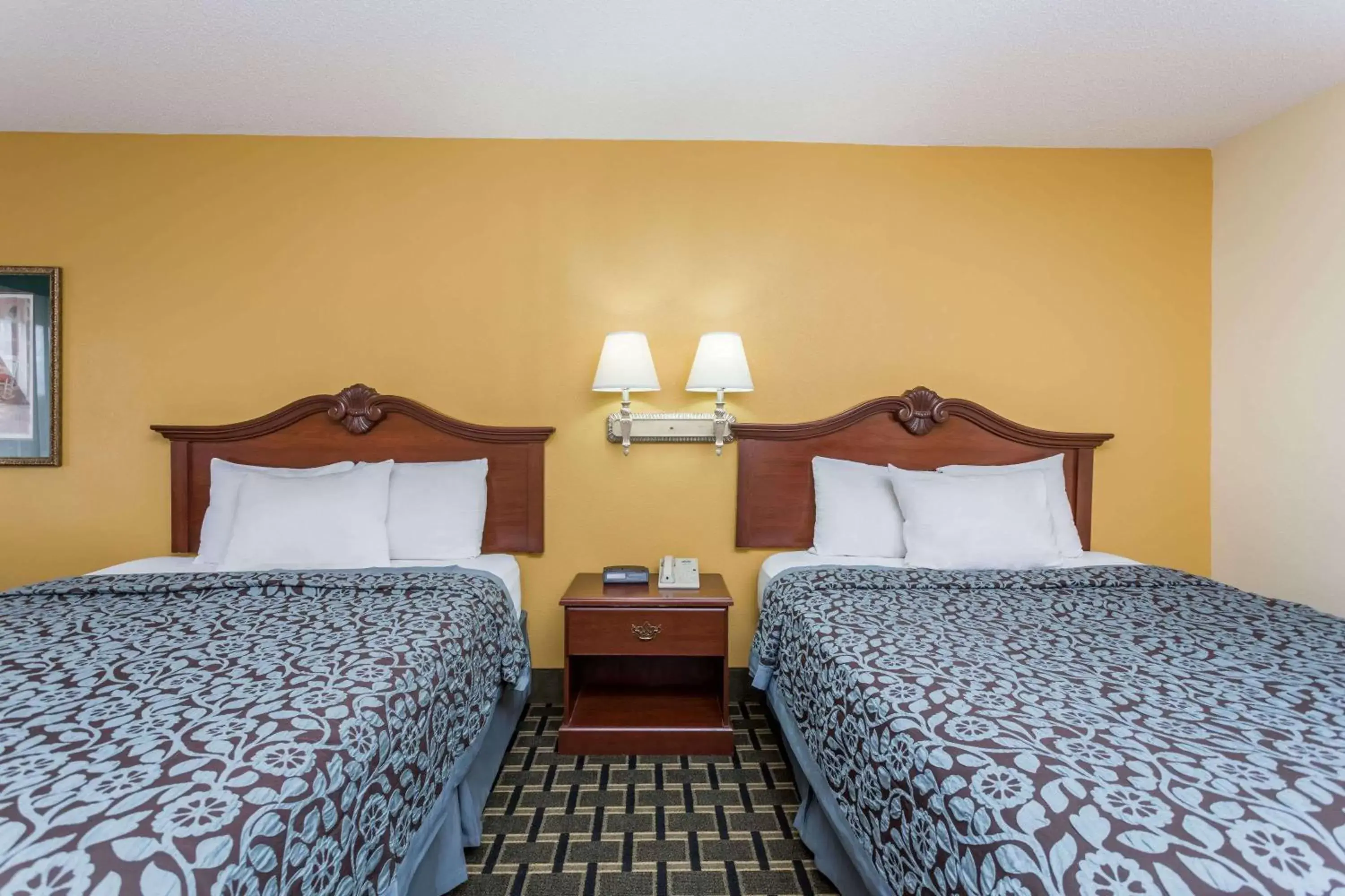 Photo of the whole room, Bed in Days Inn & Suites by Wyndham Warner Robins Near Robins AFB