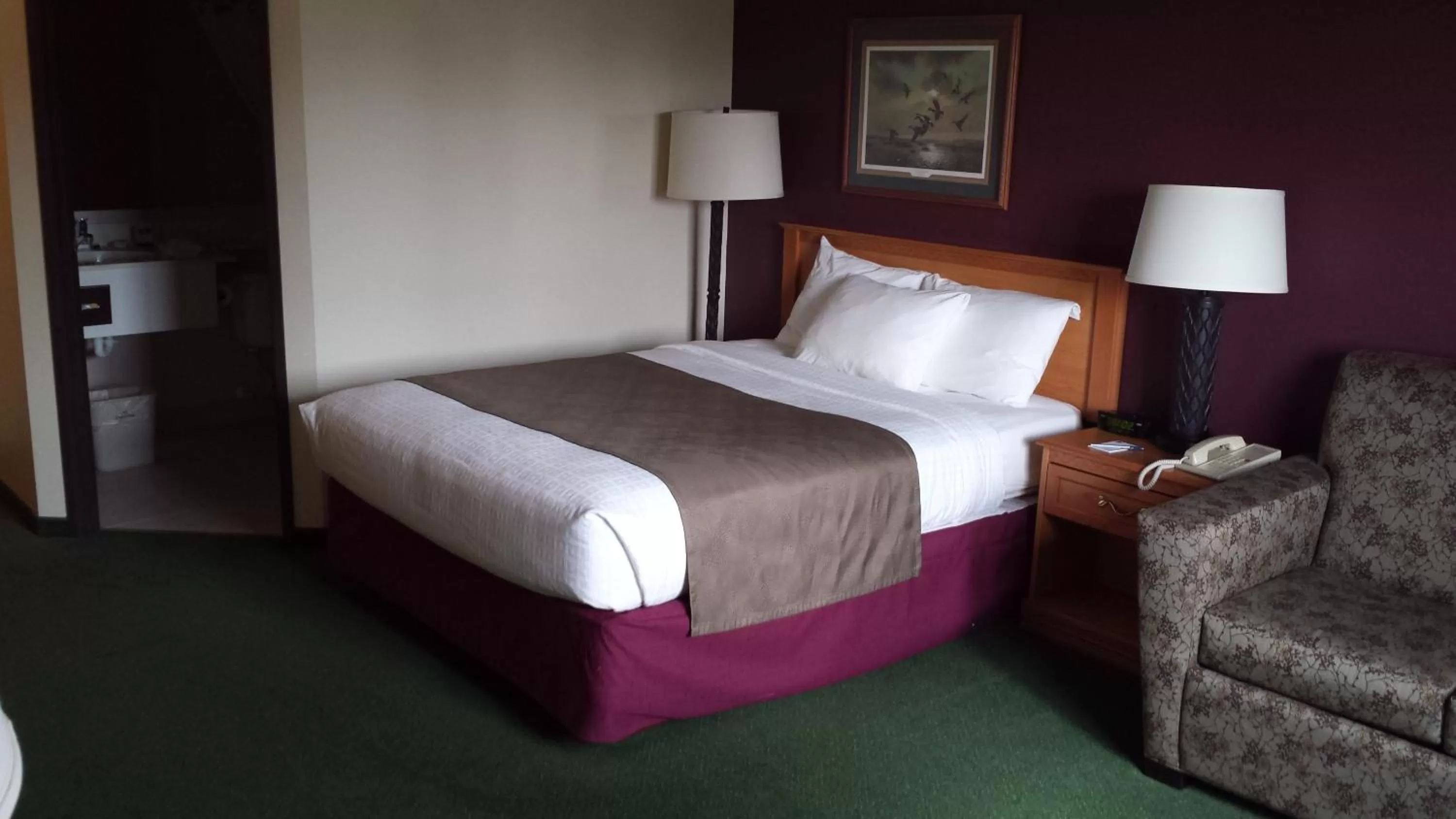 Bed in AmericInn by Wyndham Madison SD