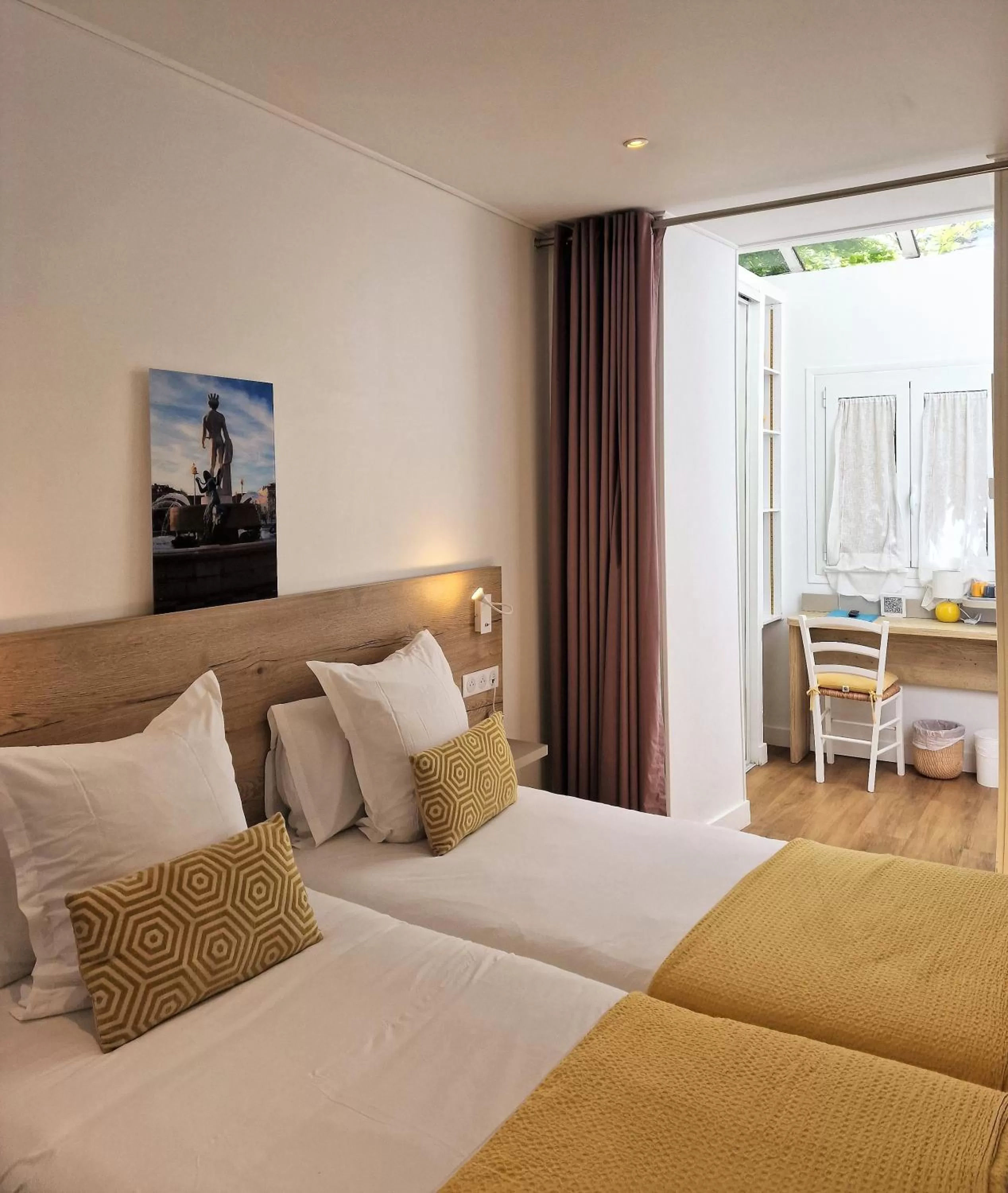 Bed in Hôtel de la Fontaine